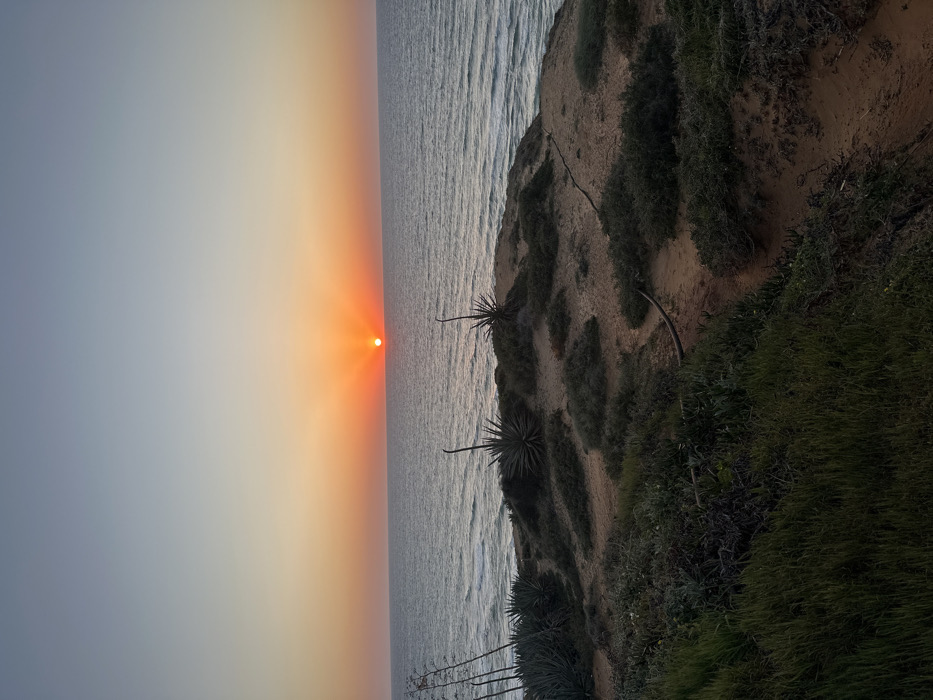 Sunset observed over coastal waters near Shefayim, Israel