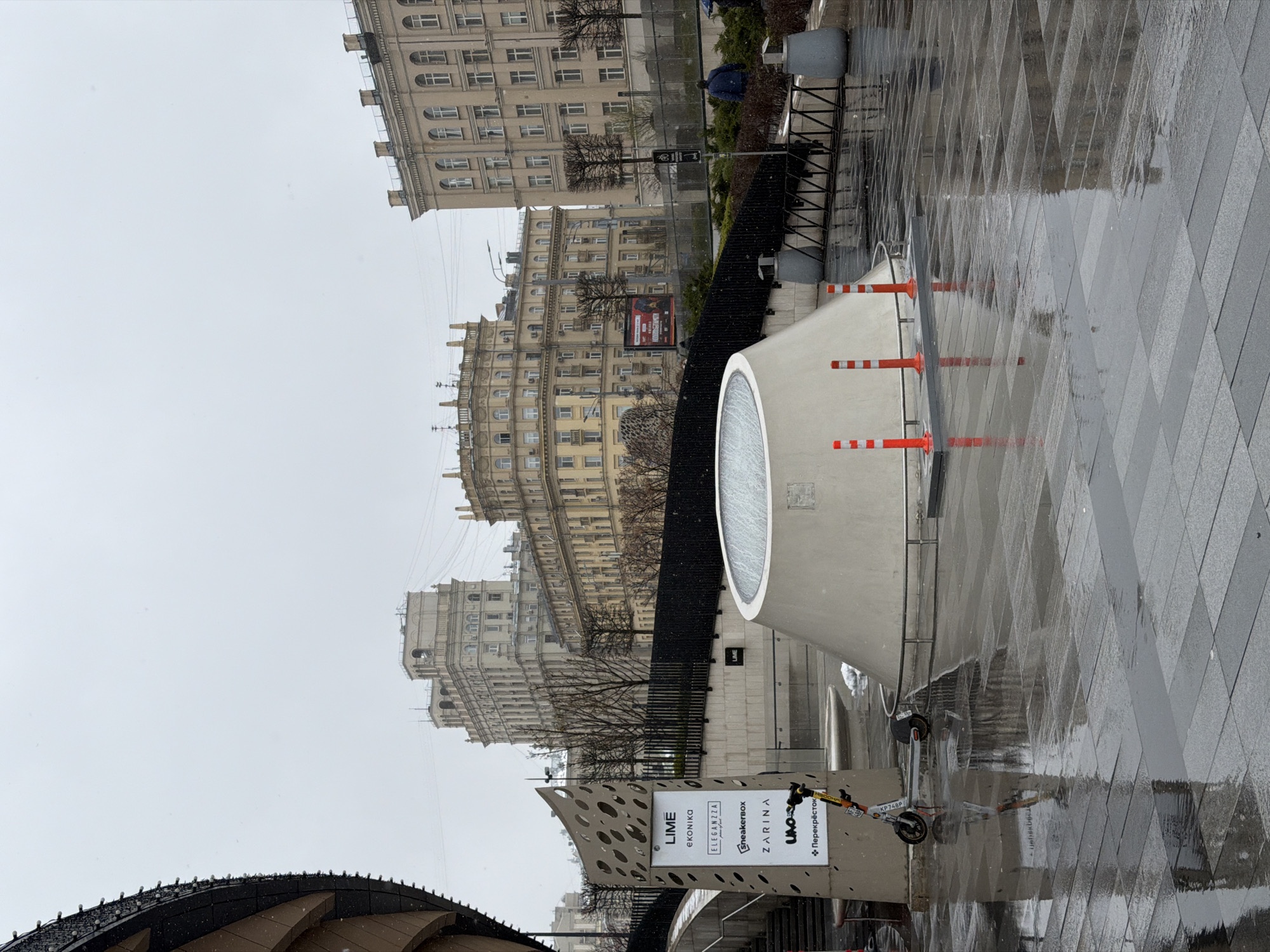 Moscow scenes show wet streets, modern mall interior