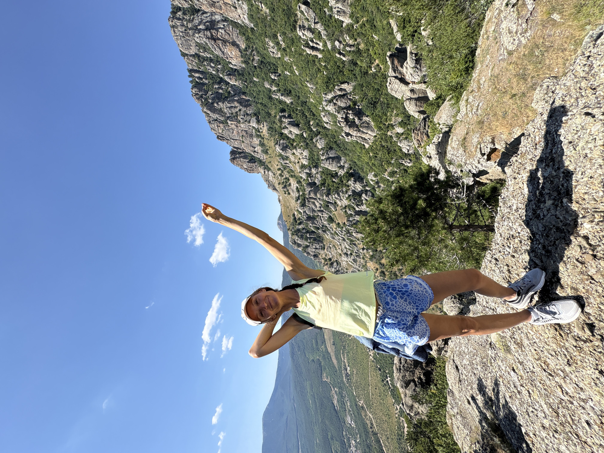Hanging out on a cliff edge above a Ukrainian mountain valley