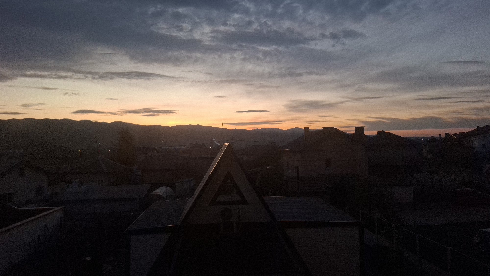 Dawn landscape captured over residential rooftops in Novi Iskar