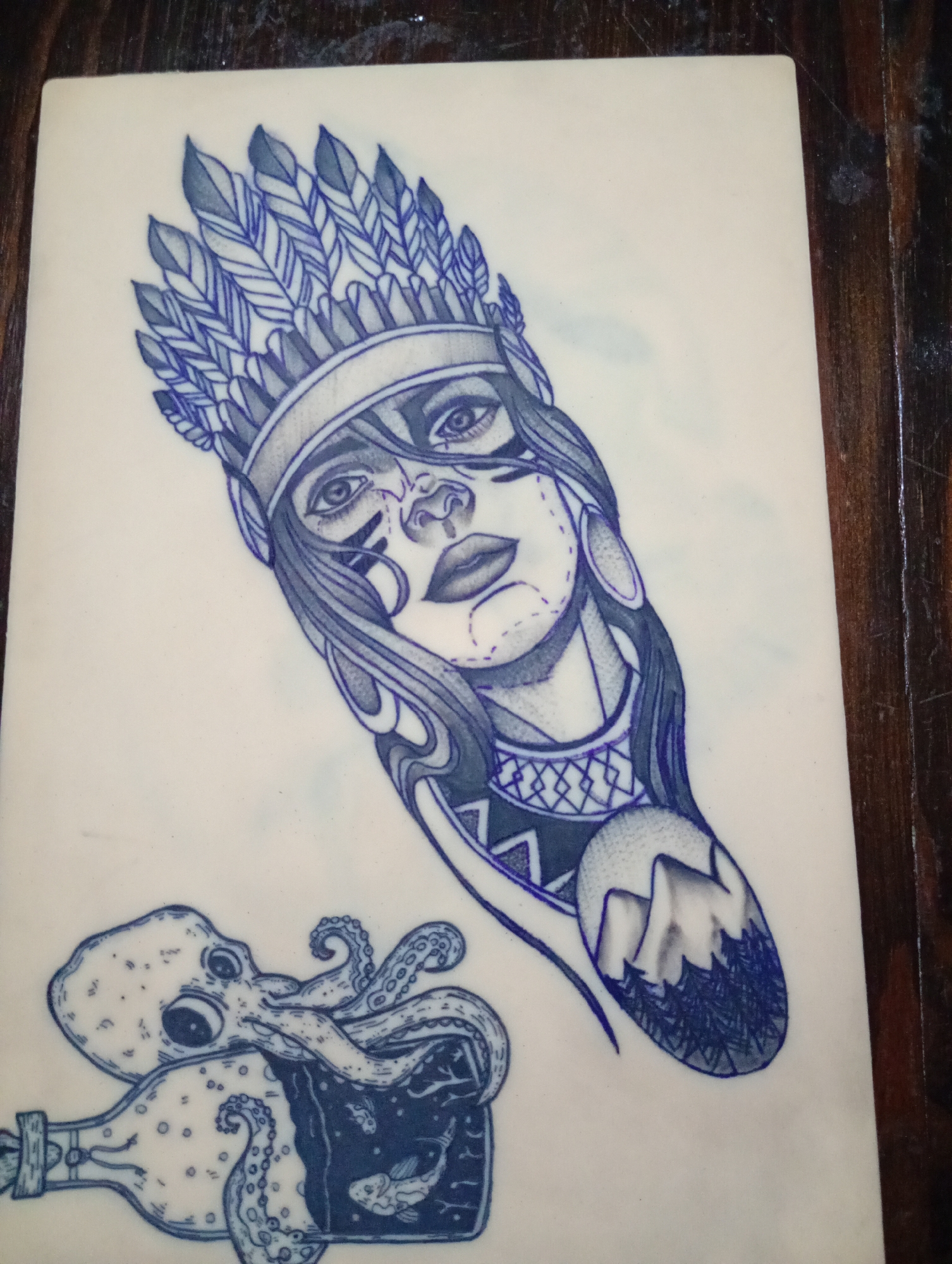 Tattoo artist practices designs during evening session in Bulgaria