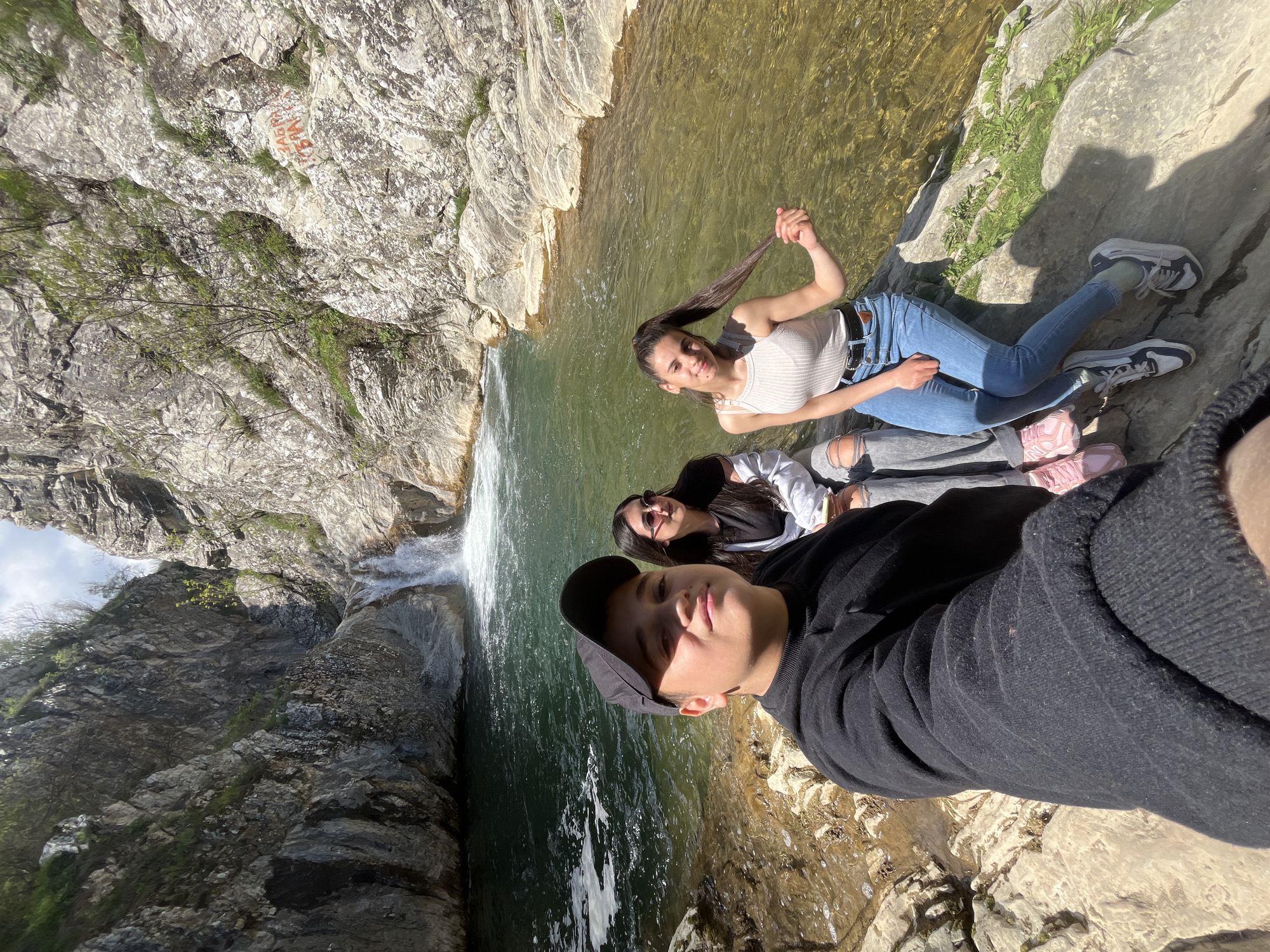 Tourists visit waterfall near Medven, Bulgaria for hiking and photos