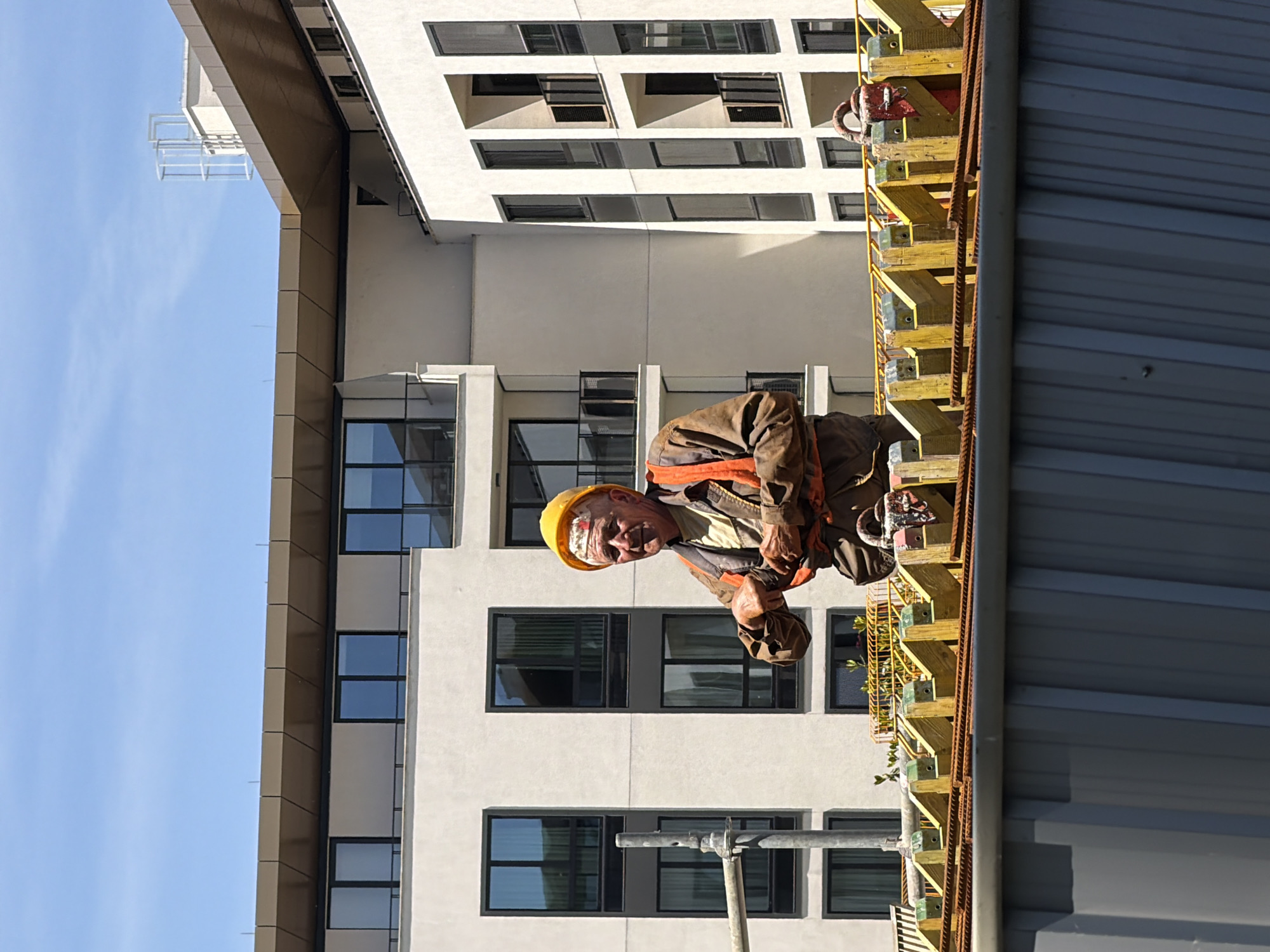 Construction worker takes cigarette break at Belgrade building site
