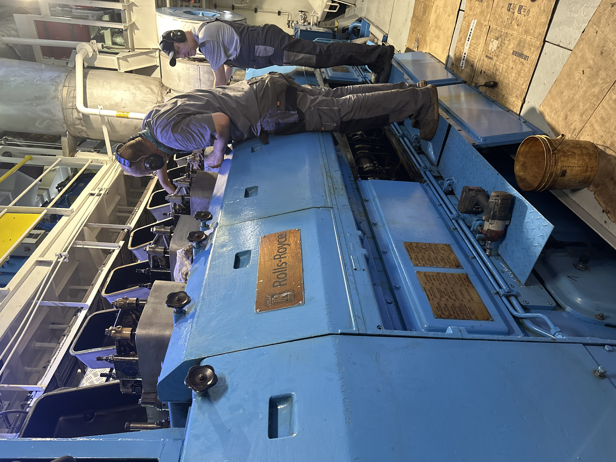 Workers service large industrial engine in Poti facility