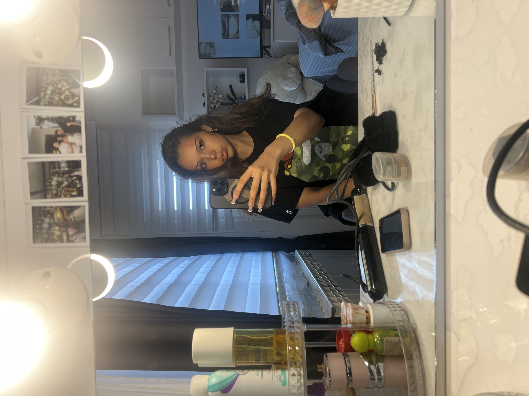 Woman takes bathroom mirror selfies during morning routine