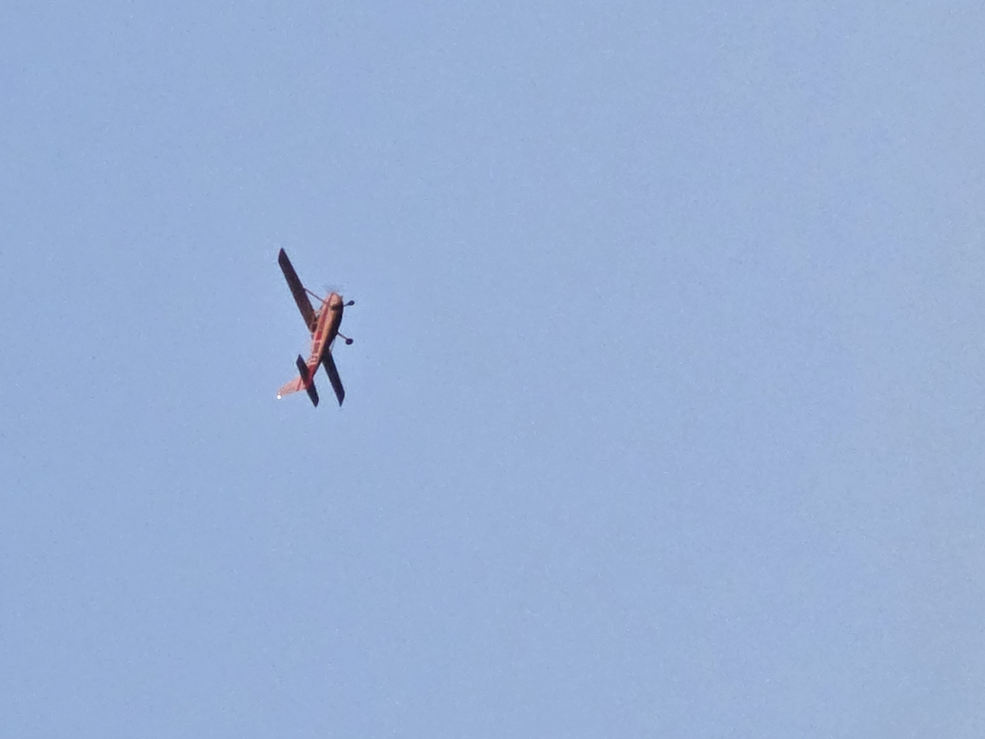 Red biplane and sunset captured in Yagodovo, Bulgaria