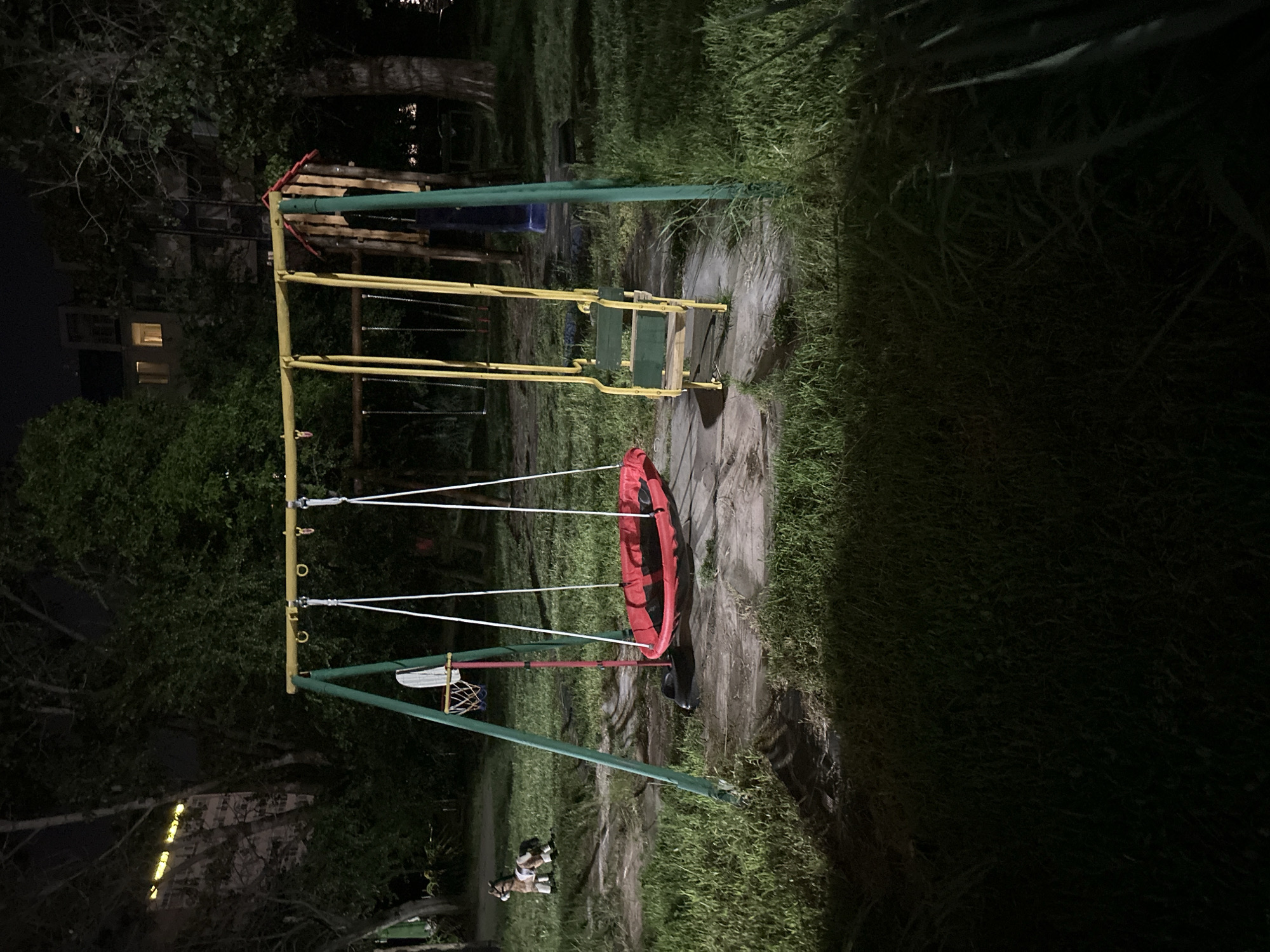 Nighttime playground structure observed under artificial lighting
