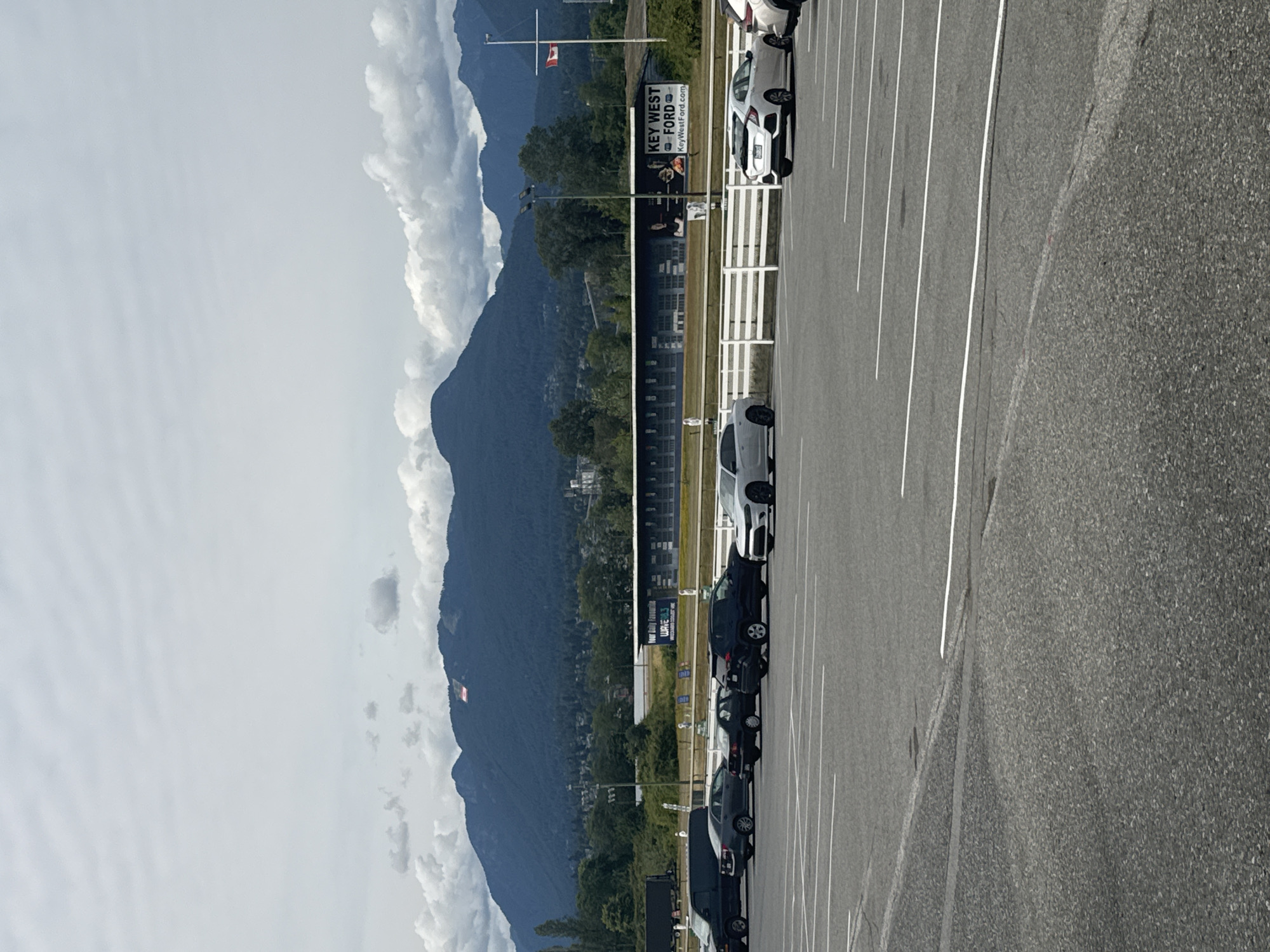 Grandstand and racetrack grounds in Vancouver, mountains behind