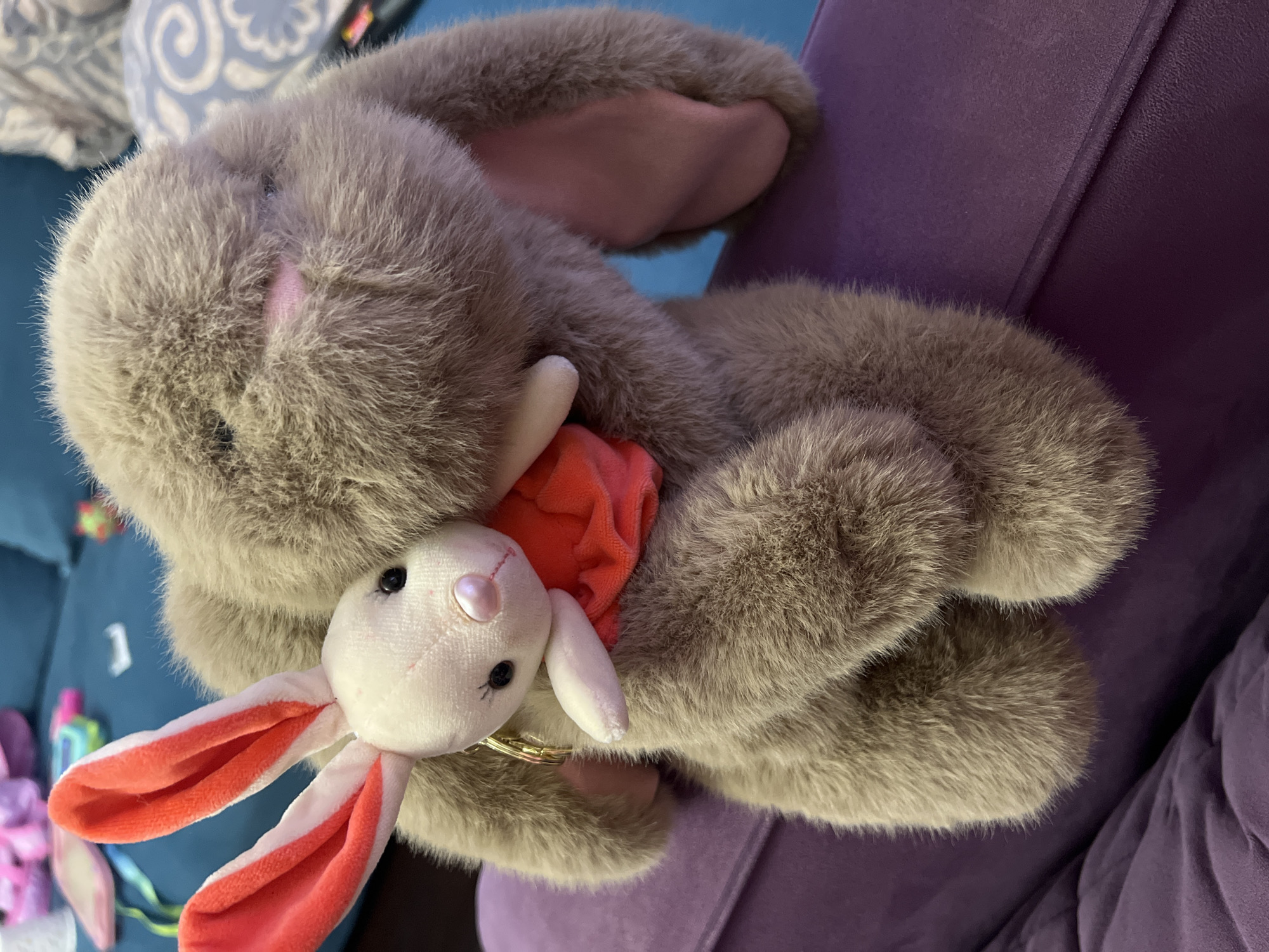 Plush toy collection photographed on purple furniture in Moscow