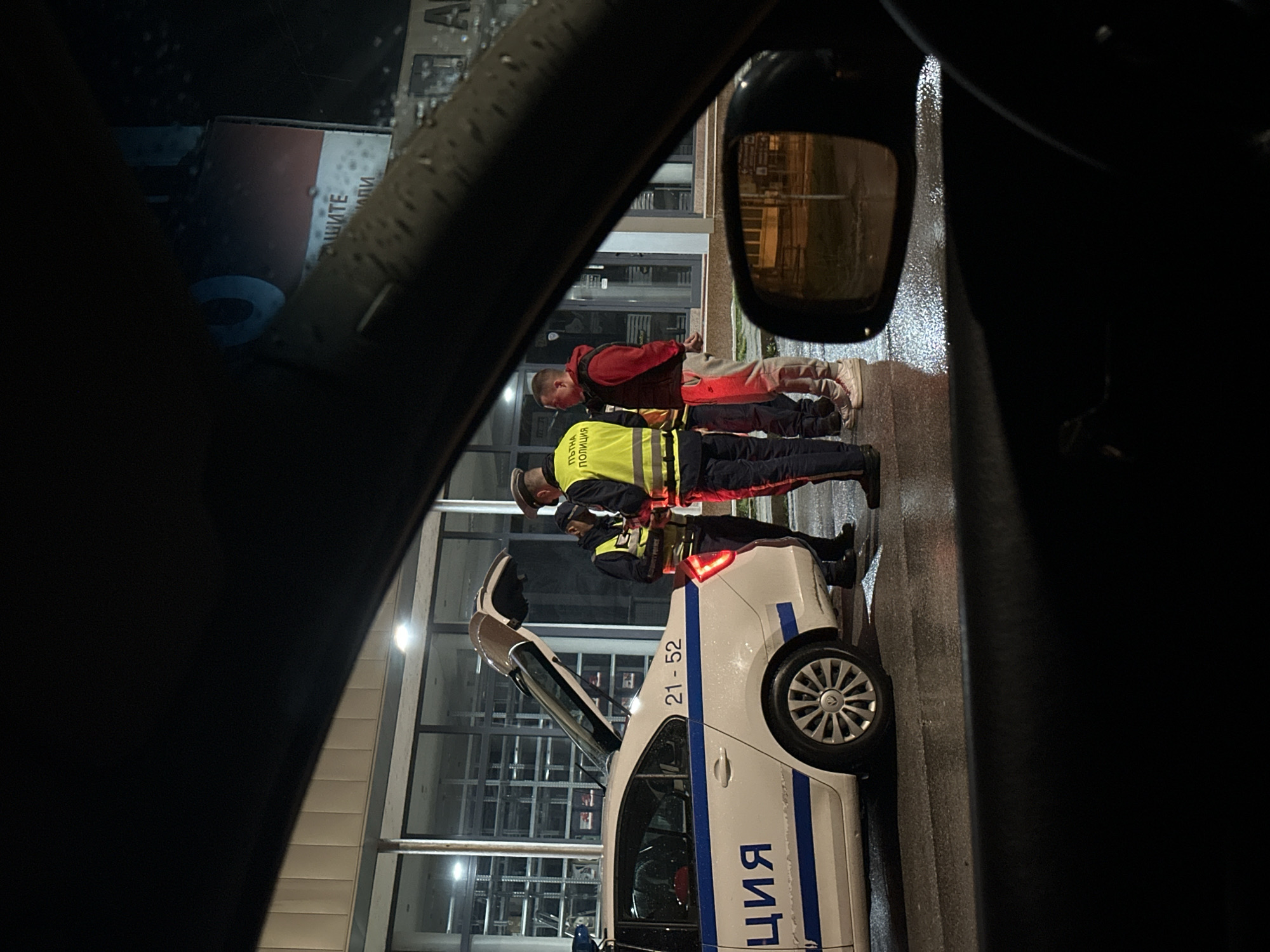 Police conduct traffic stop in rainy Smolyan evening