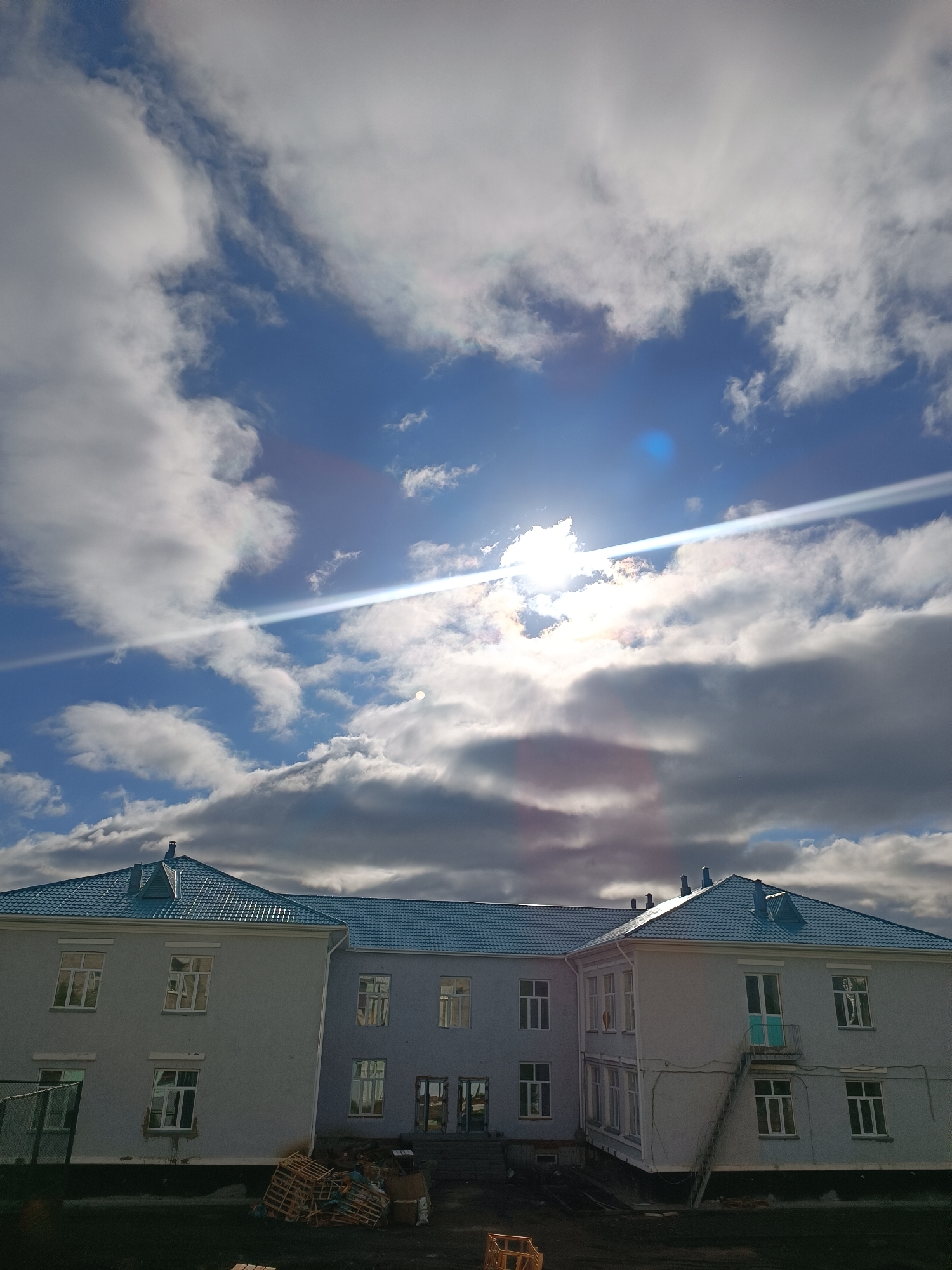 Two-story building with blue roof documented in Kokshetau, Kazakhstan