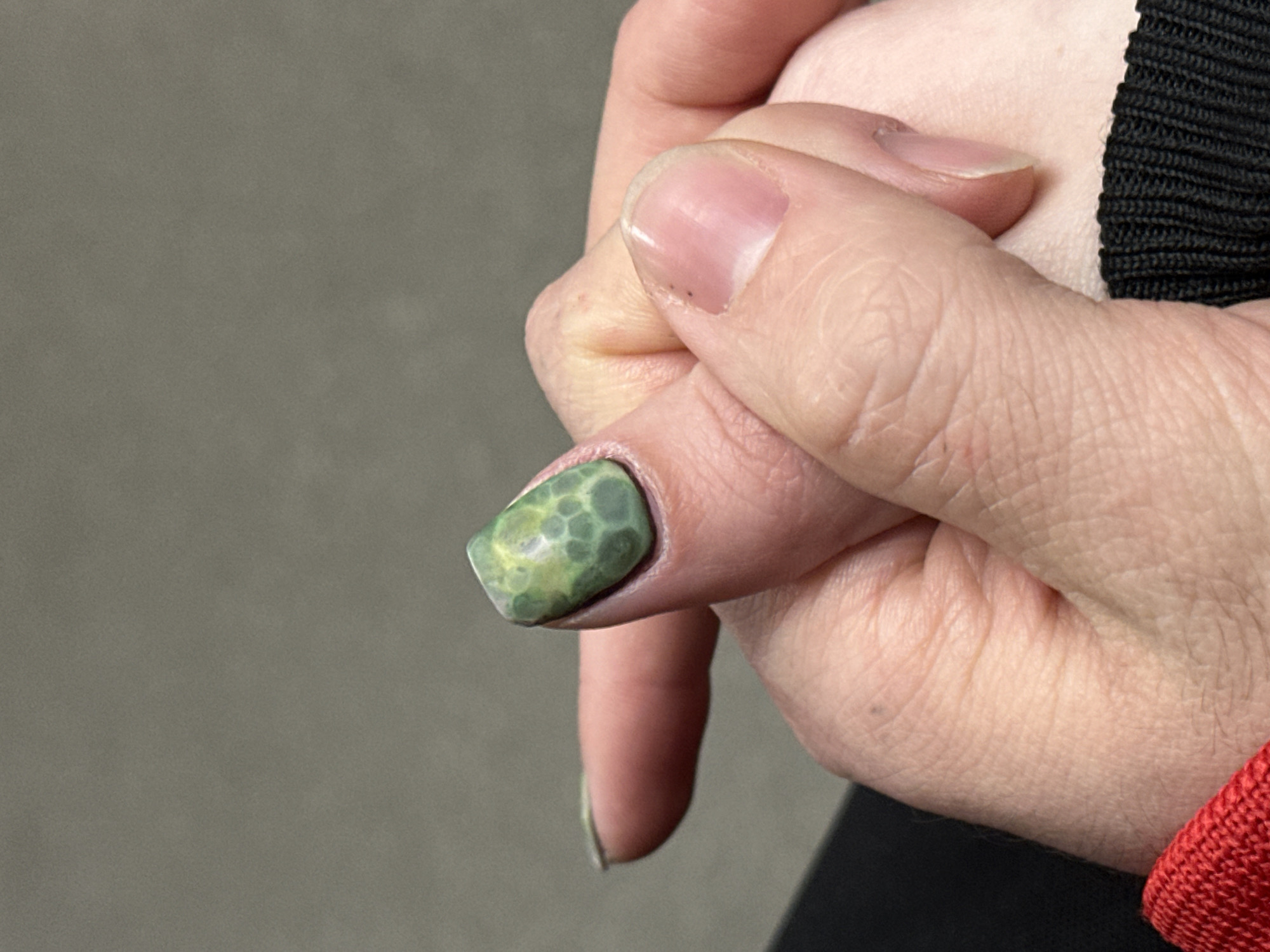 Moscow resident showcases colorful personal style with nail art, bright sneakers