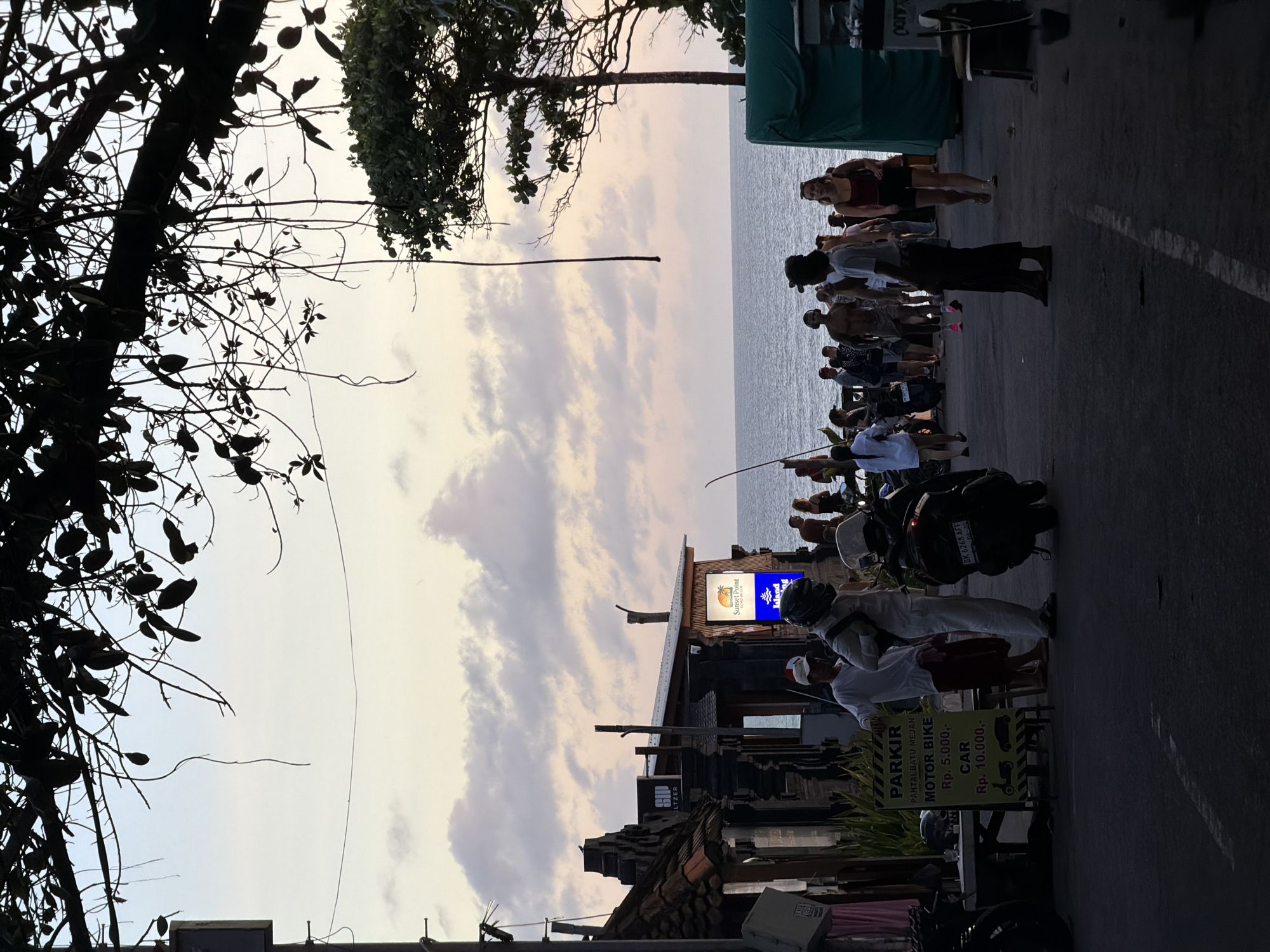 Crowd gathers at Sunset Point seaside location in North Kuta