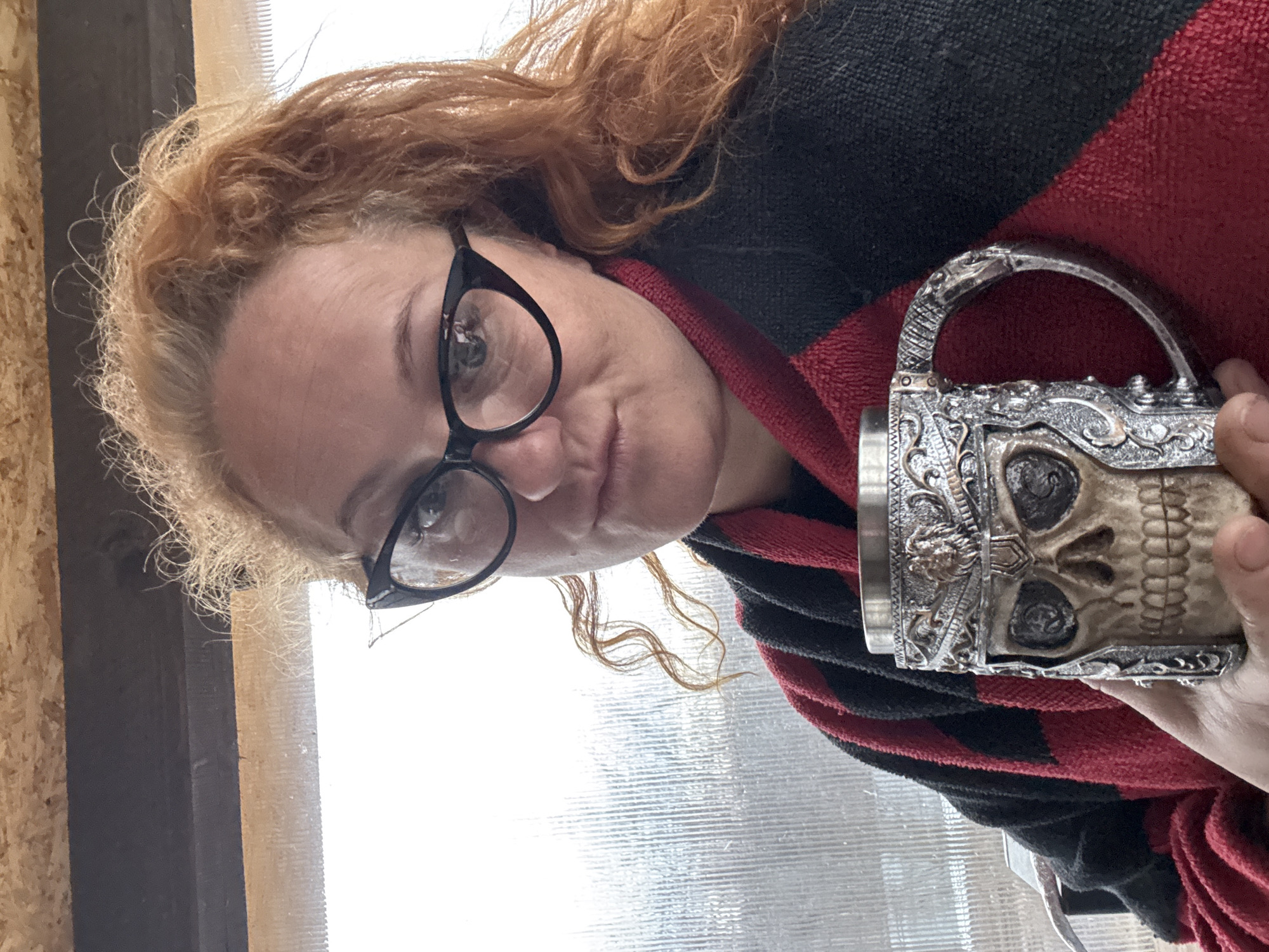 Woman photographed in costume with decorative mugs in Chaikovsky