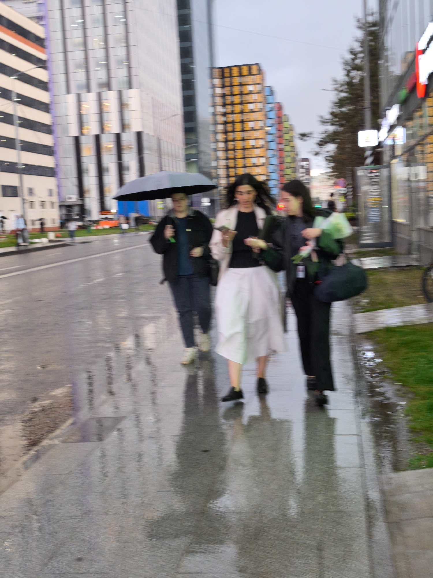 Rainy afternoon documented across multiple Moscow city blocks
