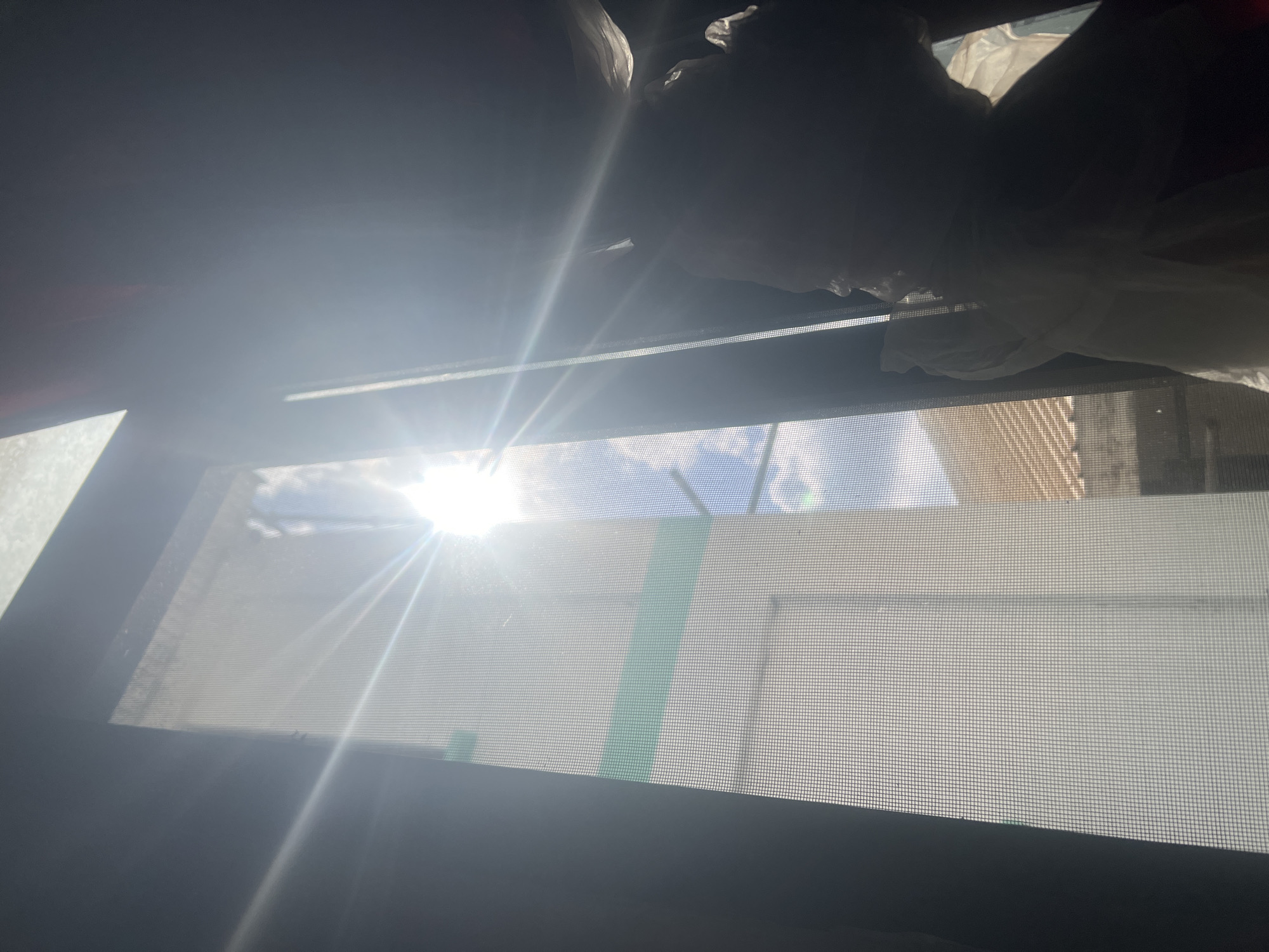 Morning window views captured from Dar es-Salaam building interior