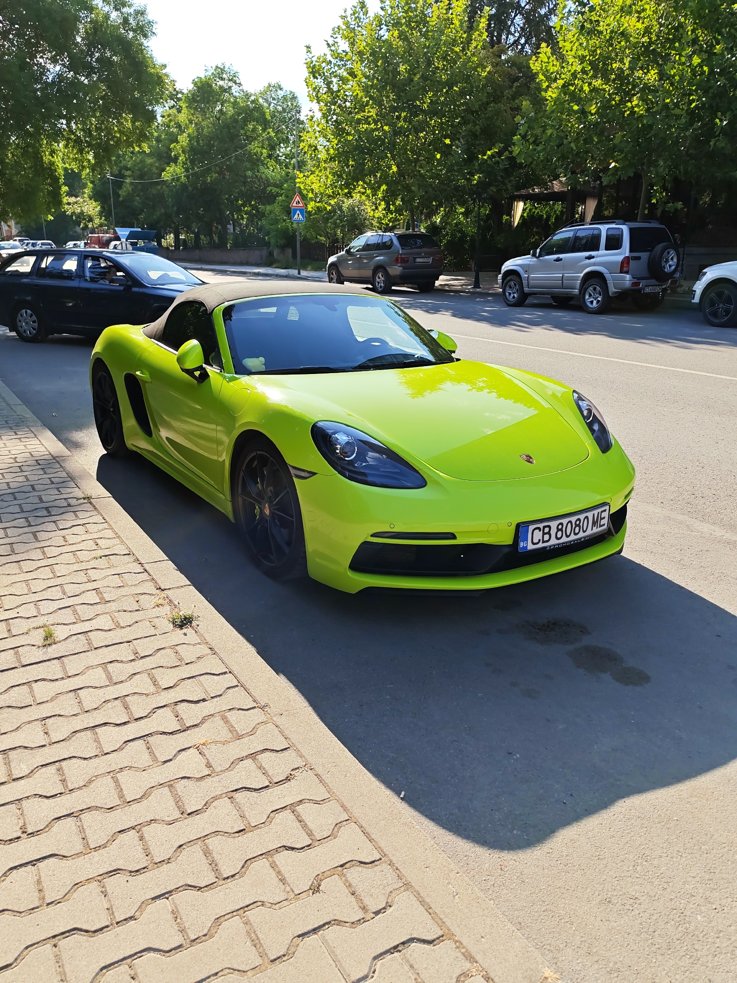 Neon green Porsche Boxster parked on a Stara Zagora street