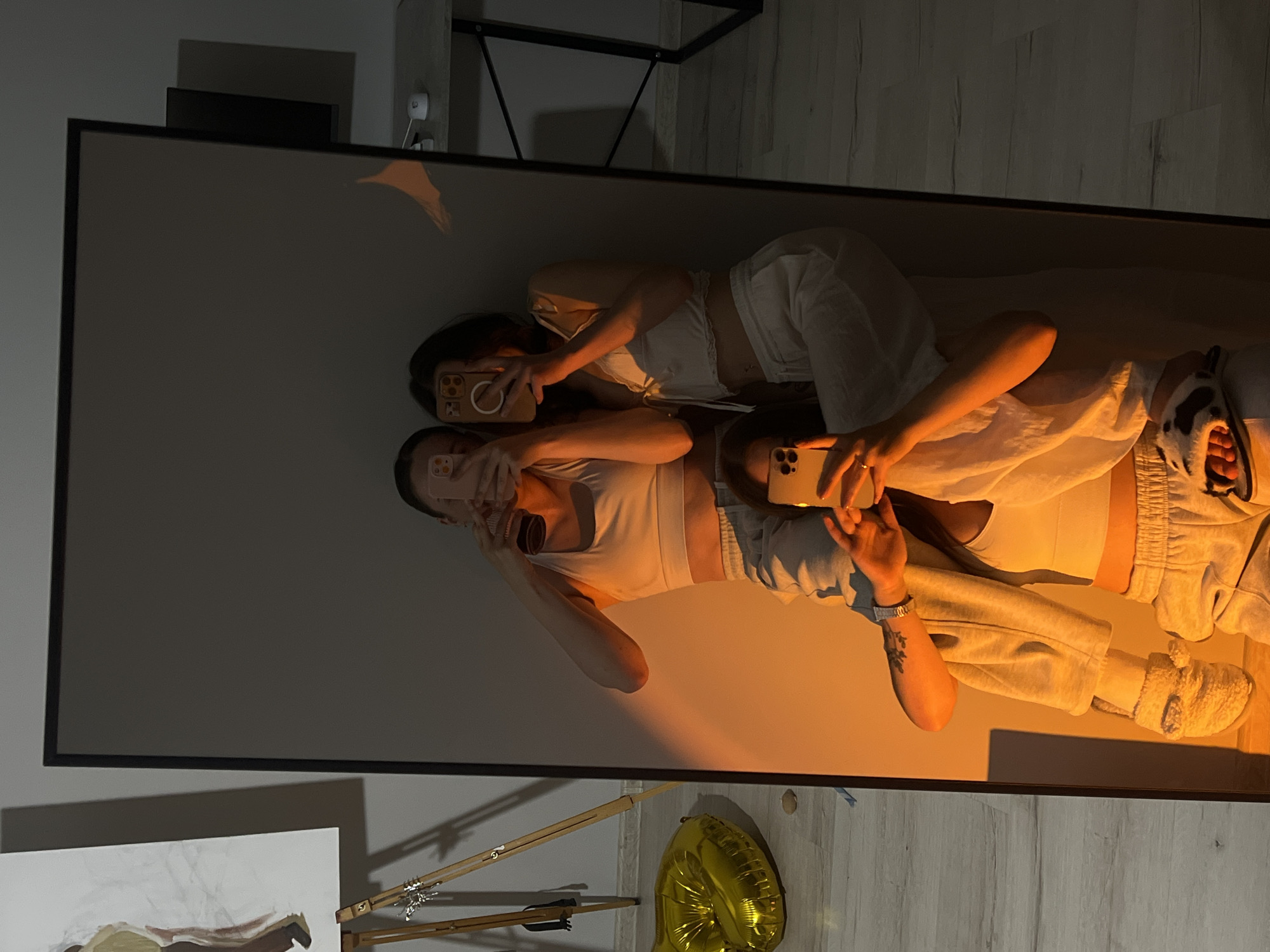 Young women take mirror selfies in Ternopil apartments