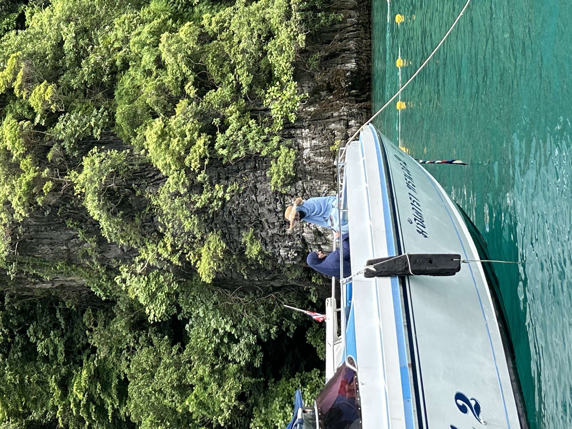 Swimming and boating at Haad Yao's cliffside waters