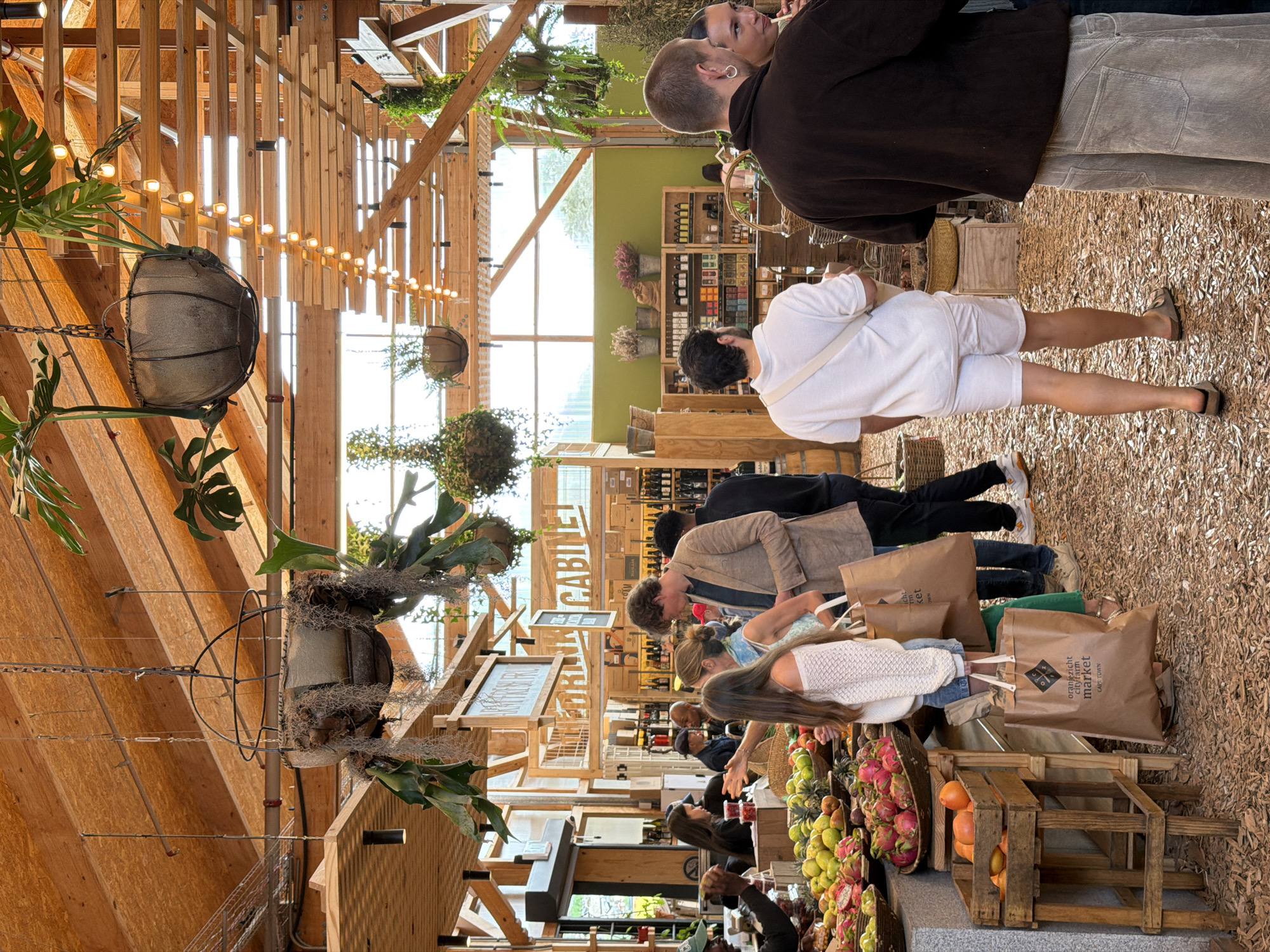 Shoppers browse Cape Town's Oranjezicht City Farm Market Saturday afternoon