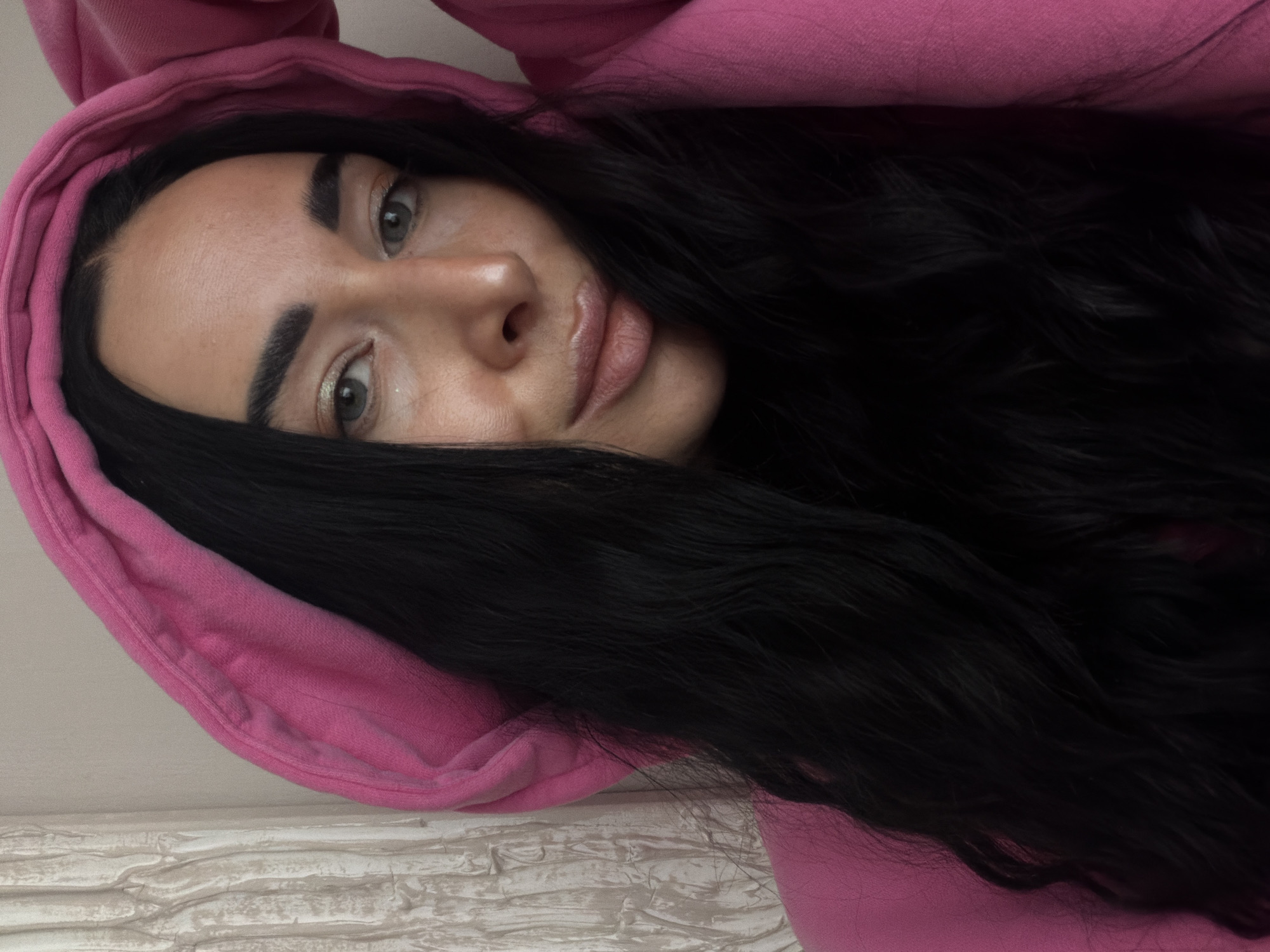 Portrait session captured in Saint Petersburg featuring pink hoodie