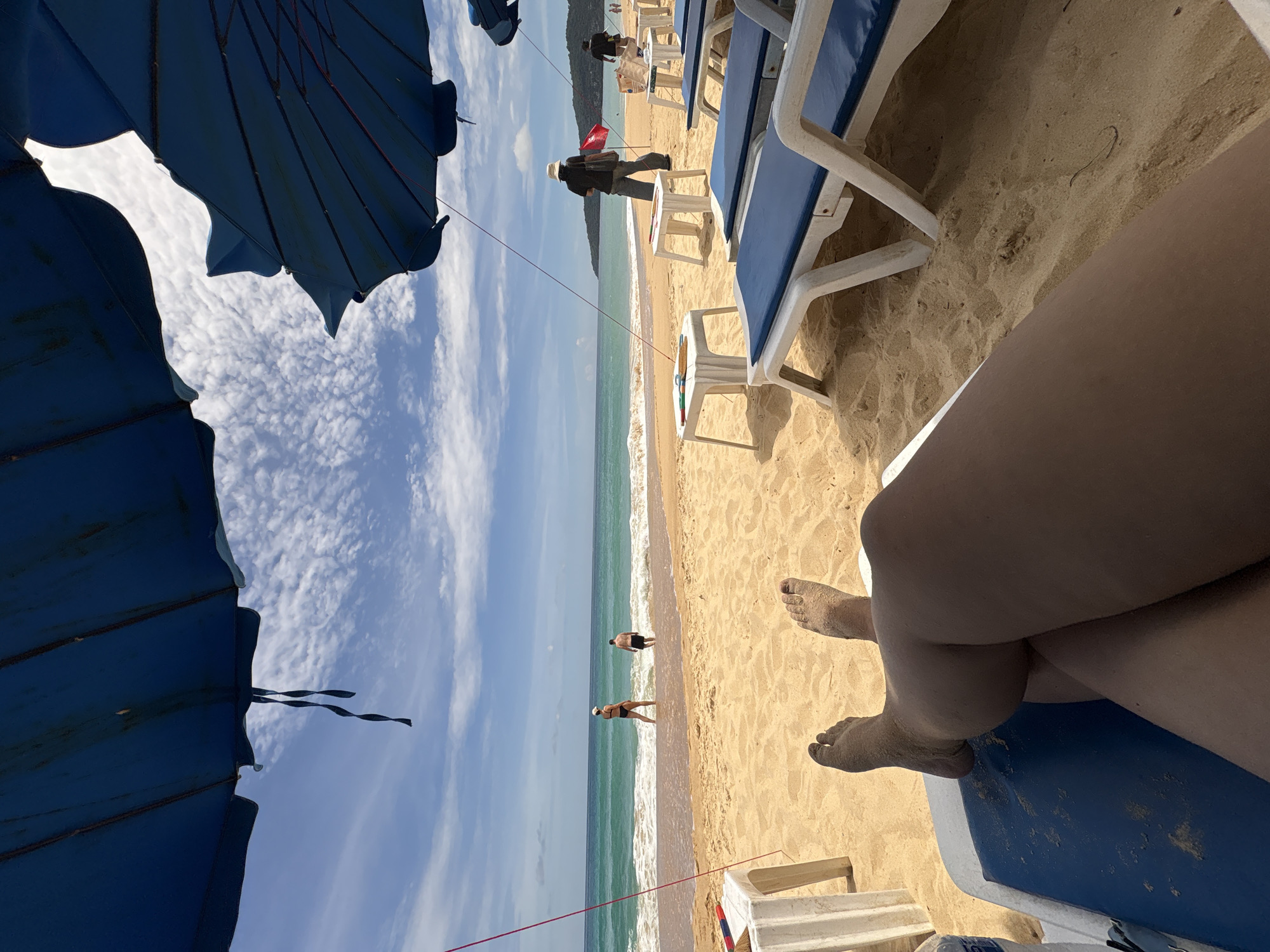 Lazy afternoon on Karon Beach, waves and sand