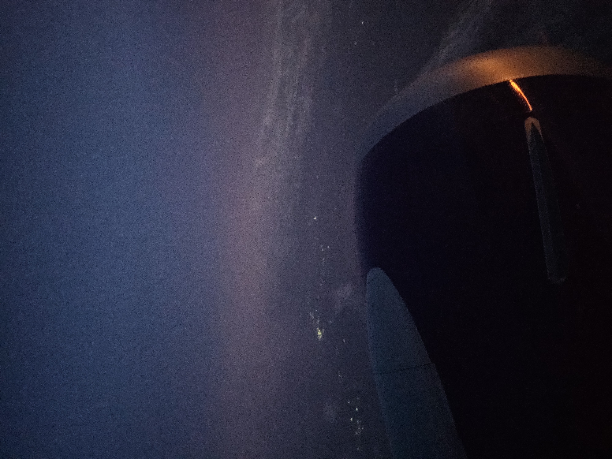 Airplane passenger documents nighttime flight over Turbo, Colombia