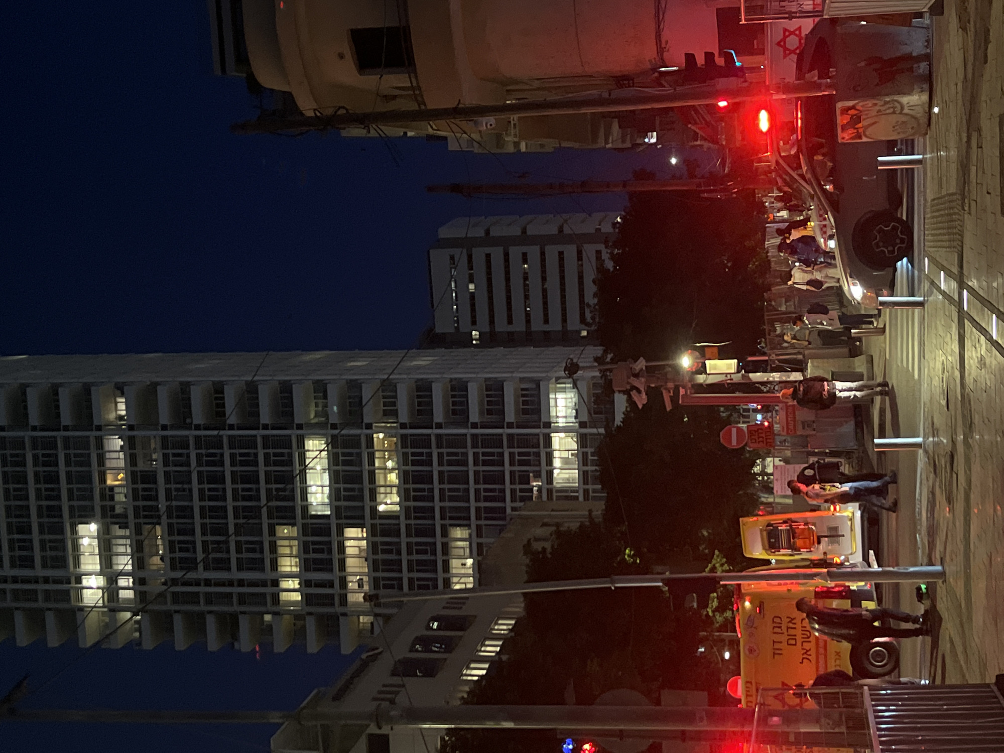 Nighttime street scene with ambulance observed in Tel-Aviv