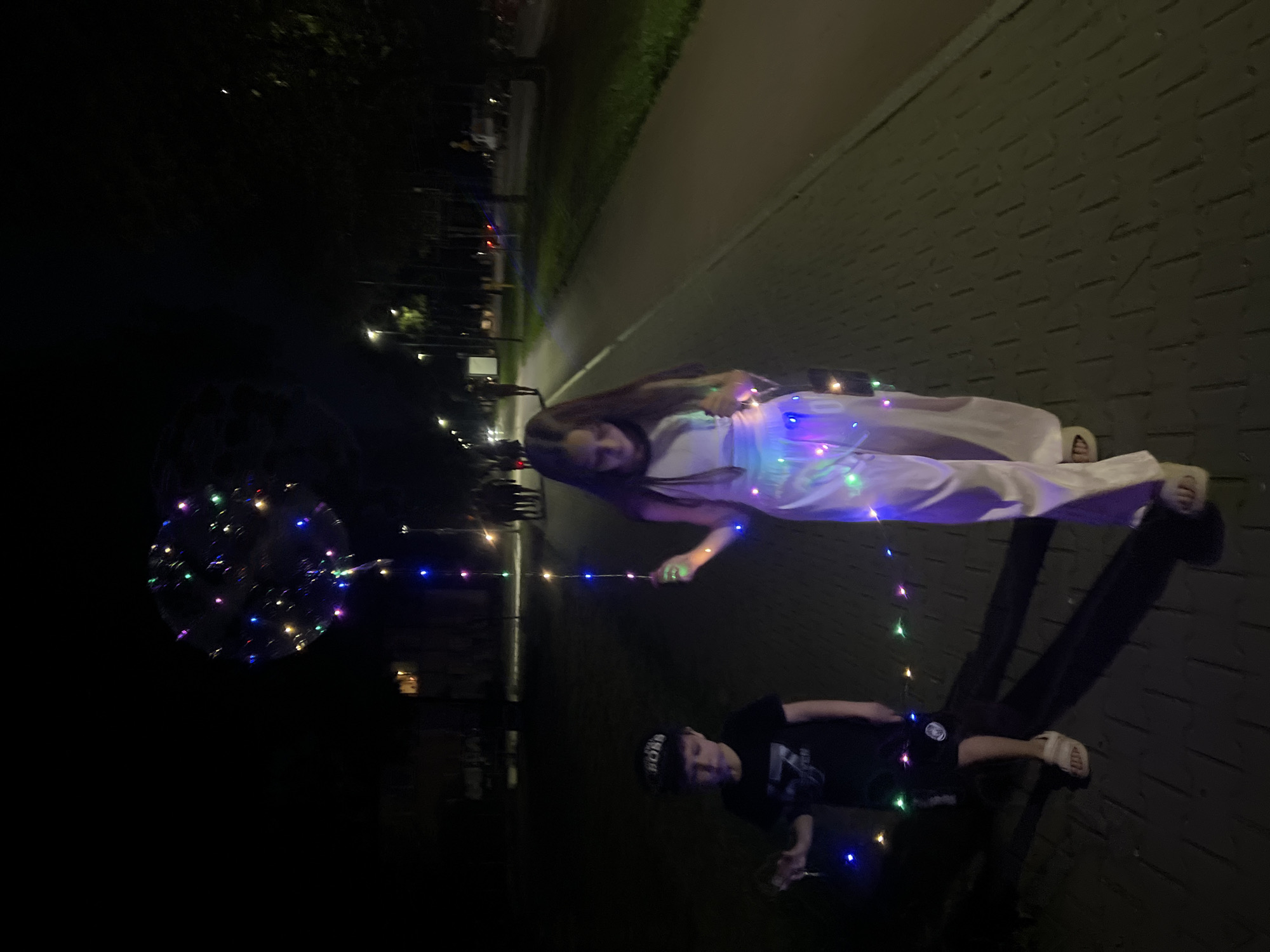 Kids with LED lights and bubbles on a night walk in Tychy