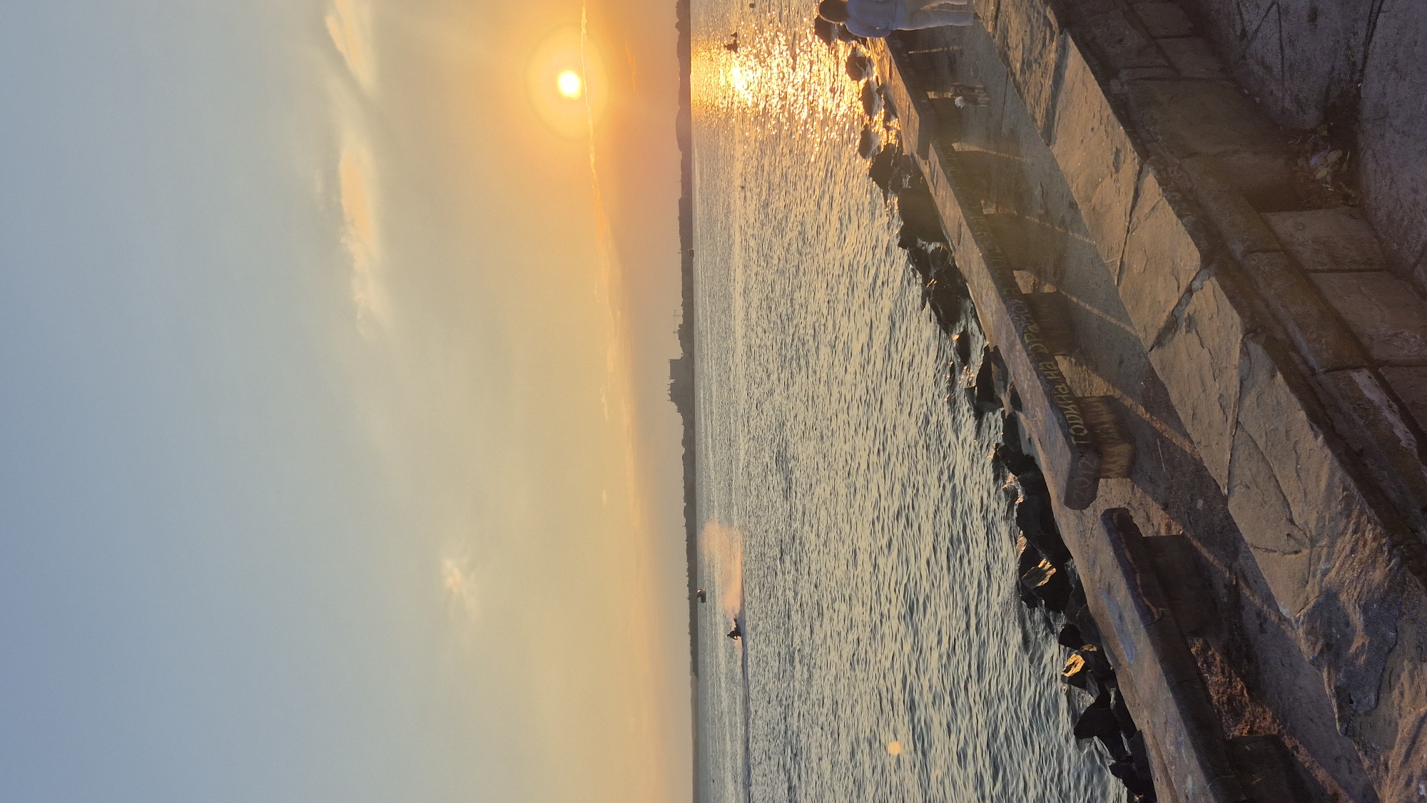 Summer evening on the Pomorie promenade, fairground and sea views