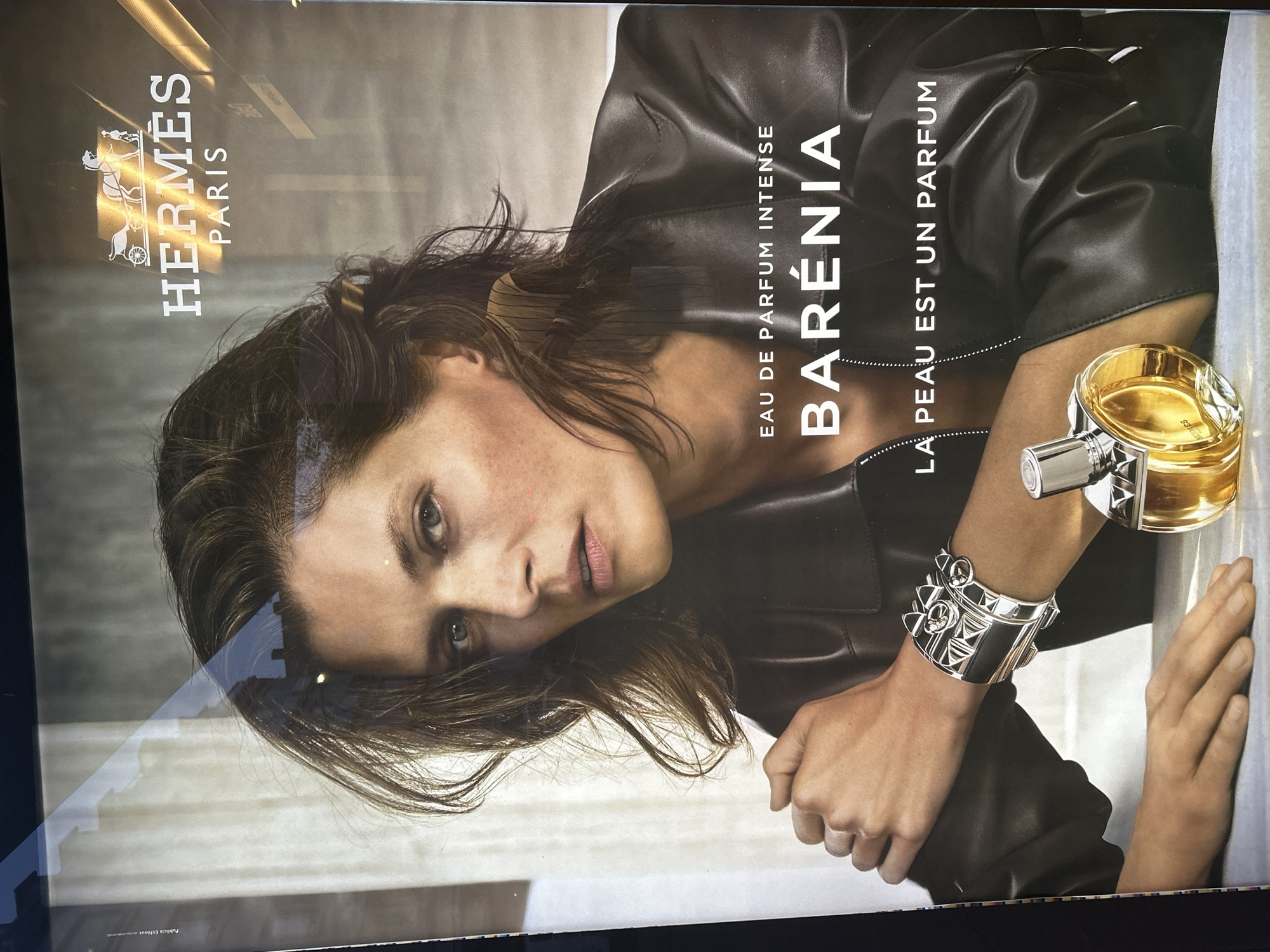 Advertisement poster spotted featuring woman in leather jacket, Strasbourg