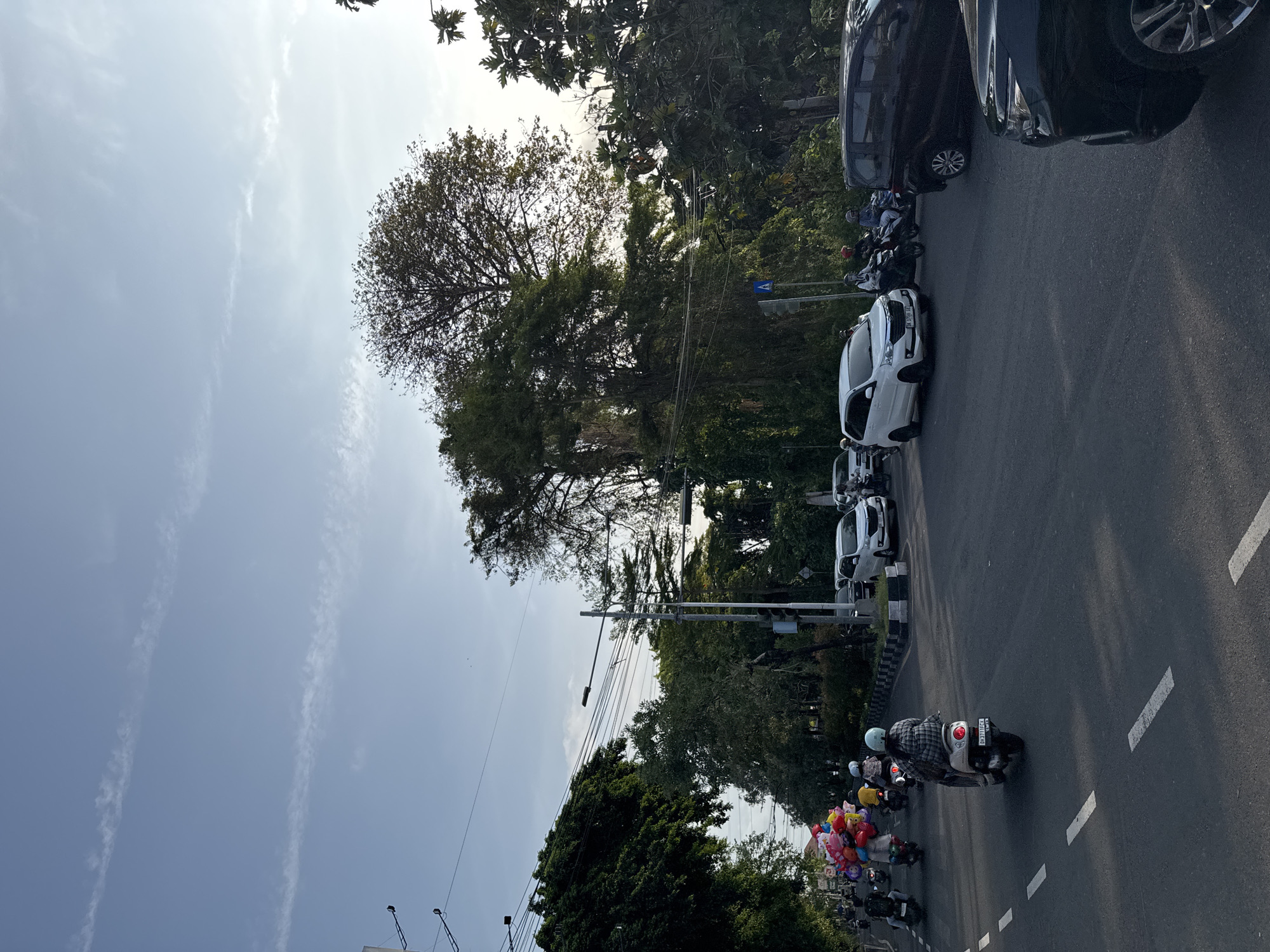 Denpasar neighborhood streets, temples, and tropical flora, one morning