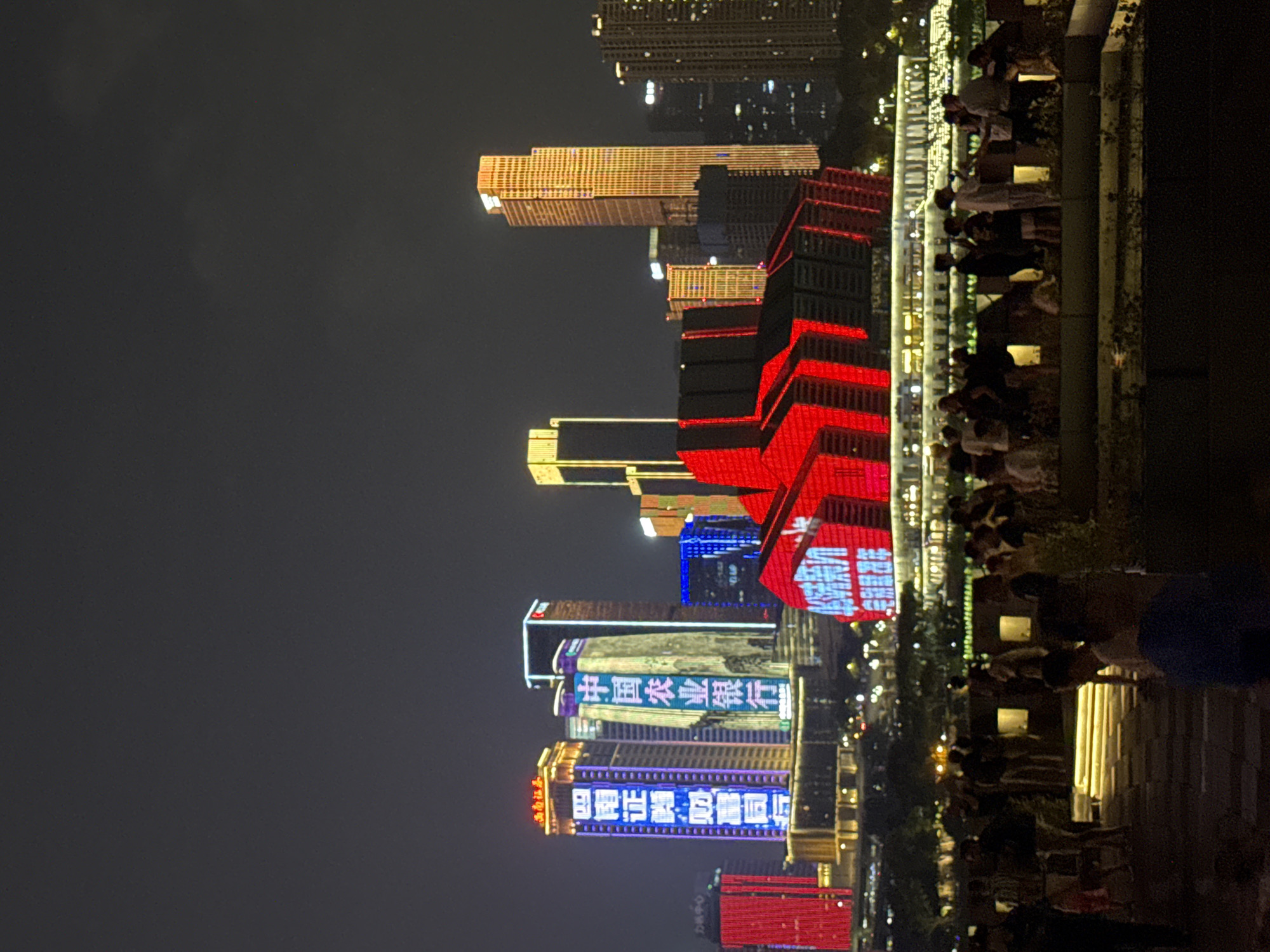 Chongqing's Yuzhong District skyline and river, lit up at night