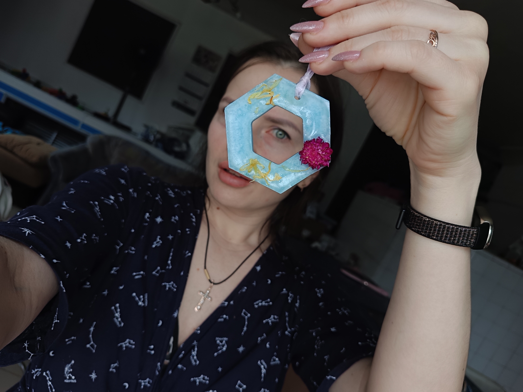 Woman documents casual indoor moments with decorative objects, flowers, pets