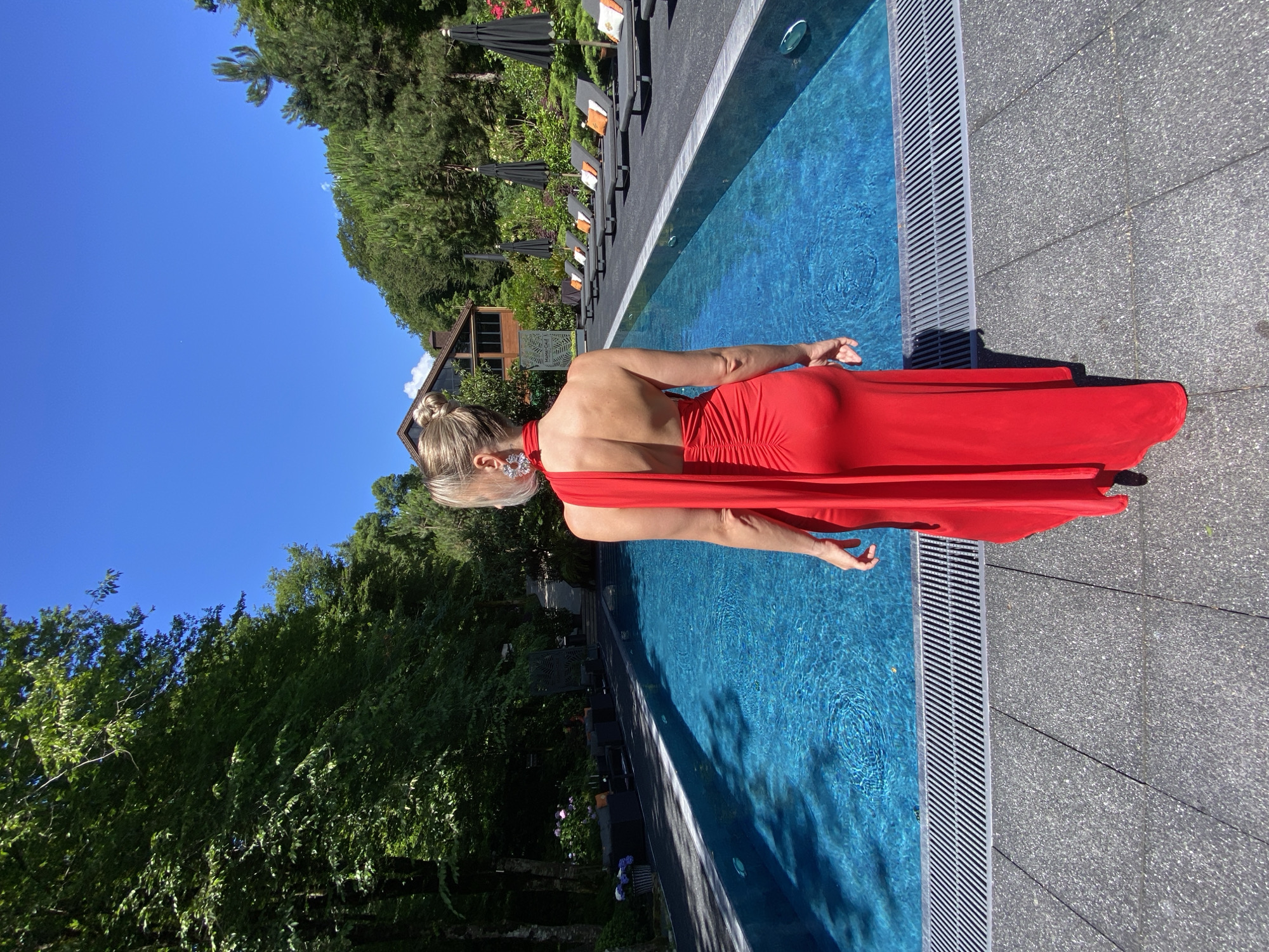 Red dress shoot at a Sochi pool and lounge