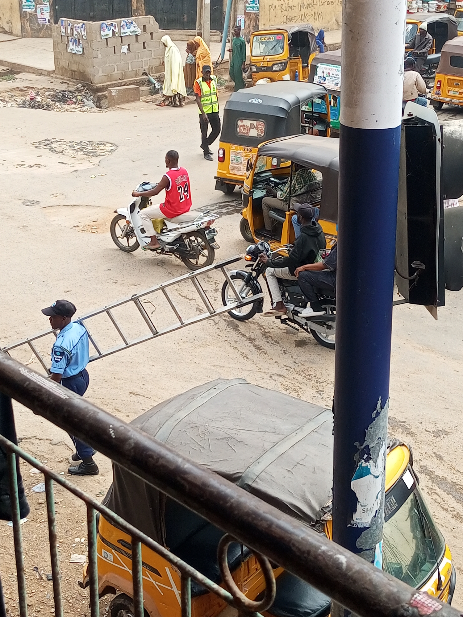 Daily street commerce bustles through Maiburiji Nigeria morning hours