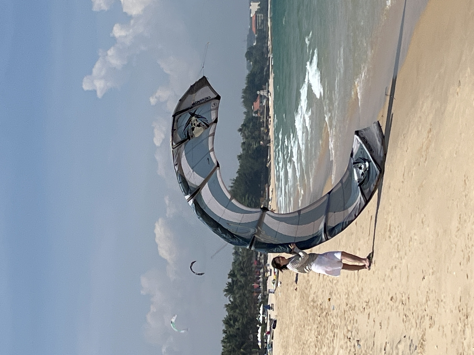 Kitesurfing and beach activity on Phan Thiet's shoreline