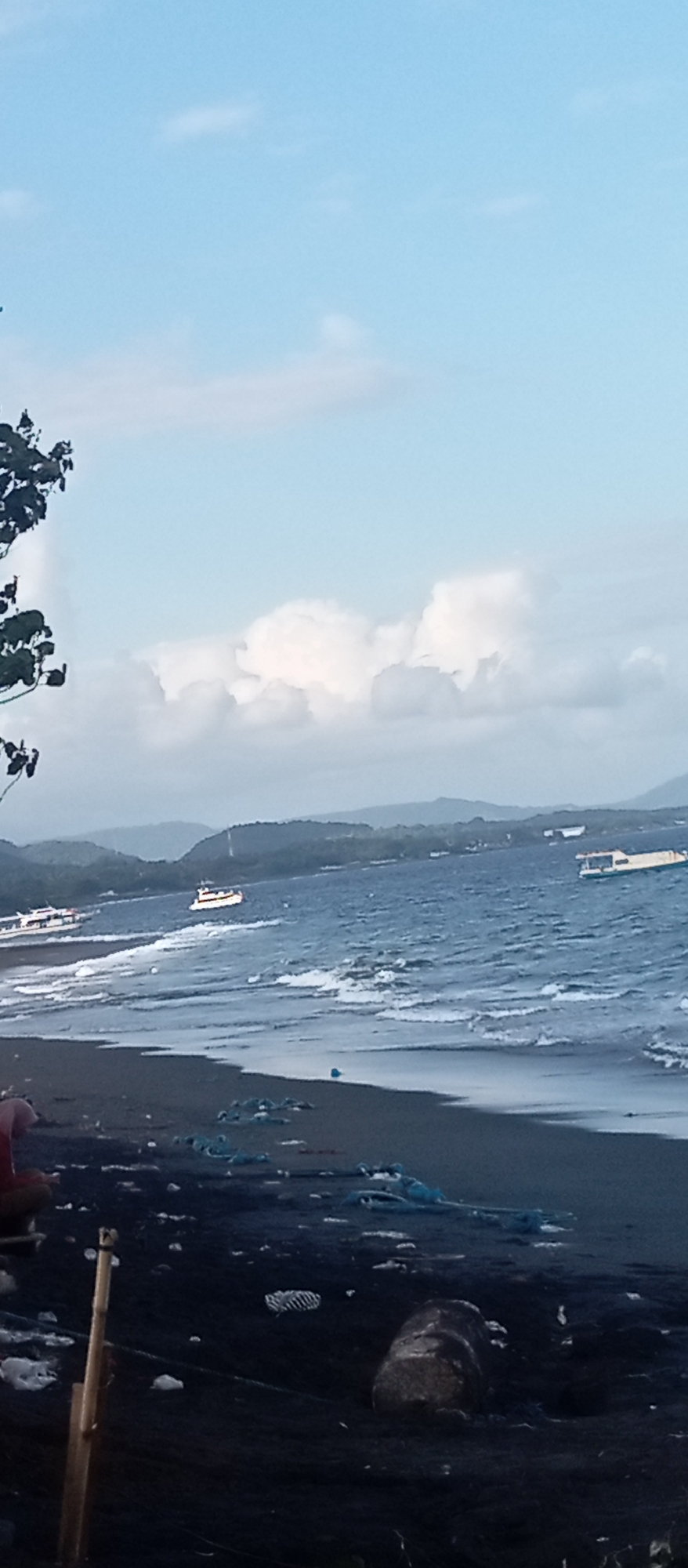 Black sand beach life along the Dawan coastline