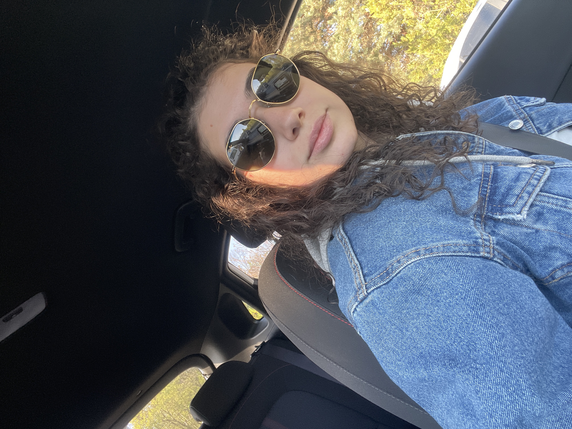 Woman takes morning car selfies in Sofia, Bulgaria
