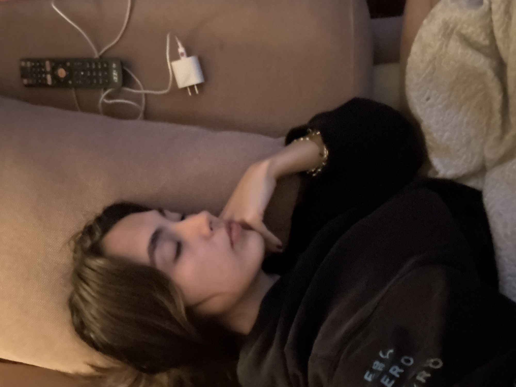 Woman sleeps on couch in Mexico City early morning