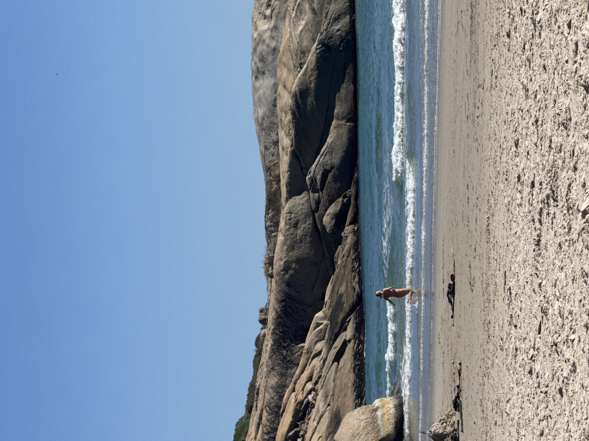 Sunny beach day brings families and surfers to Hout Bay