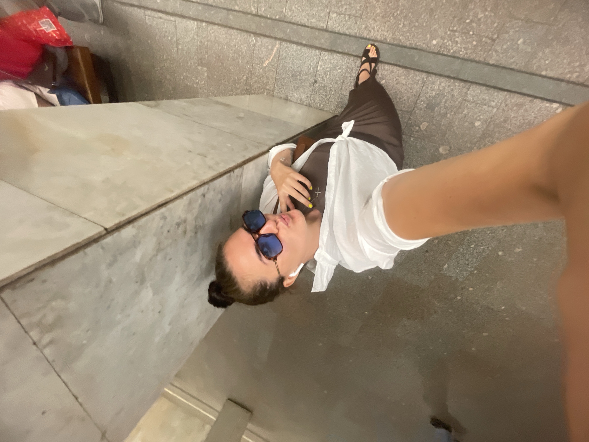 Selfie moment in a Moscow public walkway, summer 2026