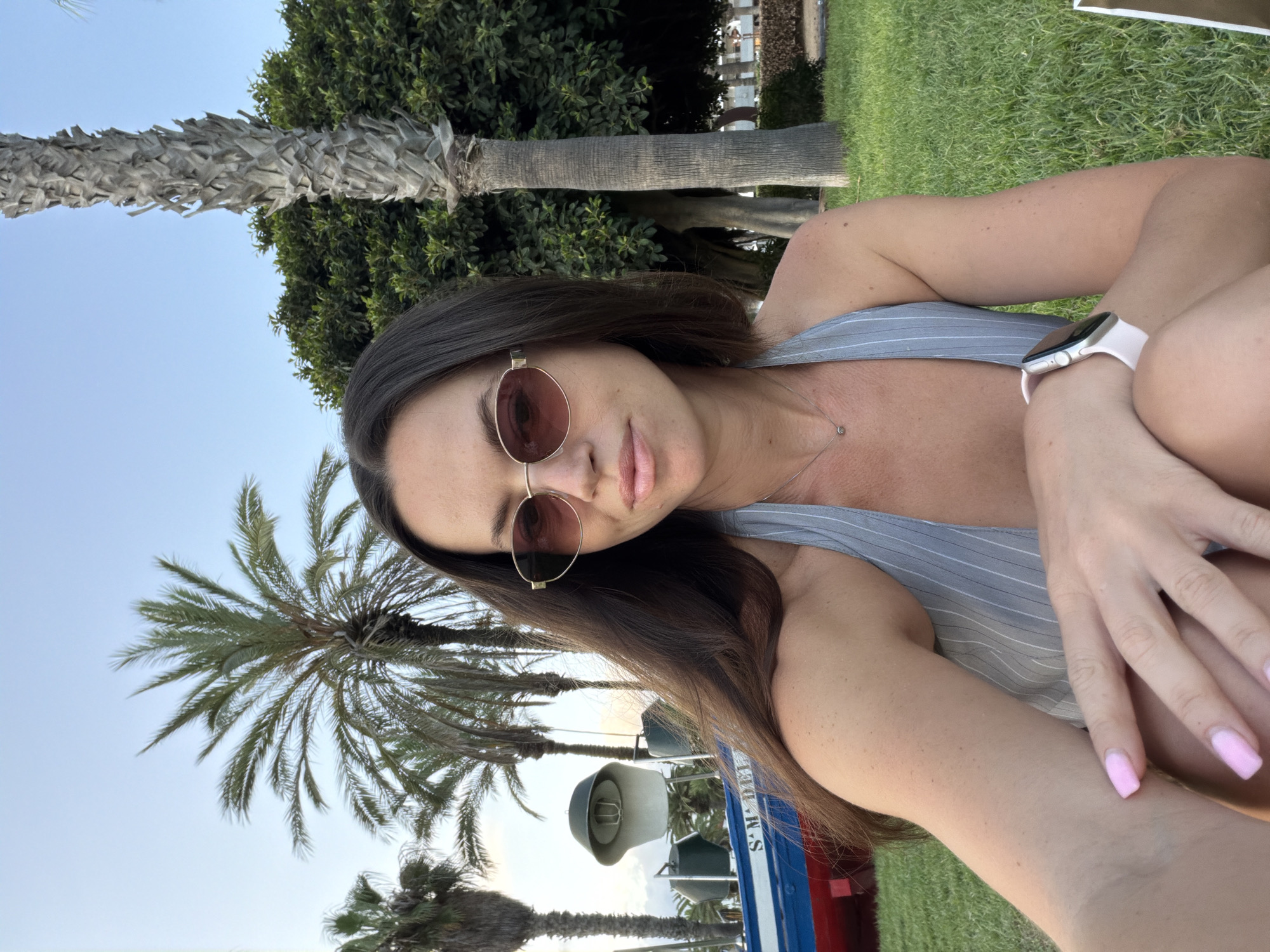 Vintage boat on display among palm trees in Salou