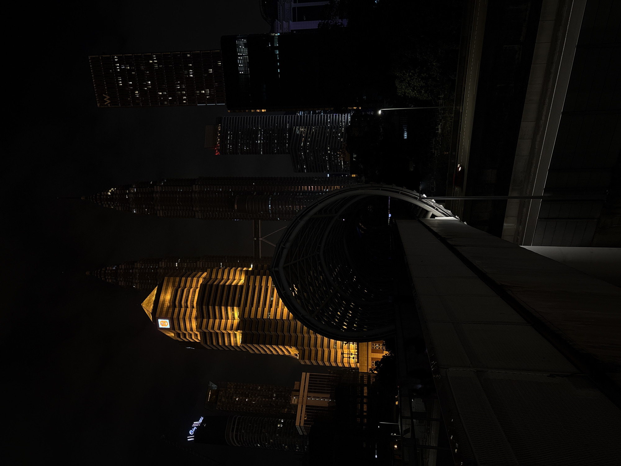 Evening skyline photography captures illuminated Kuala Lumpur landmarks