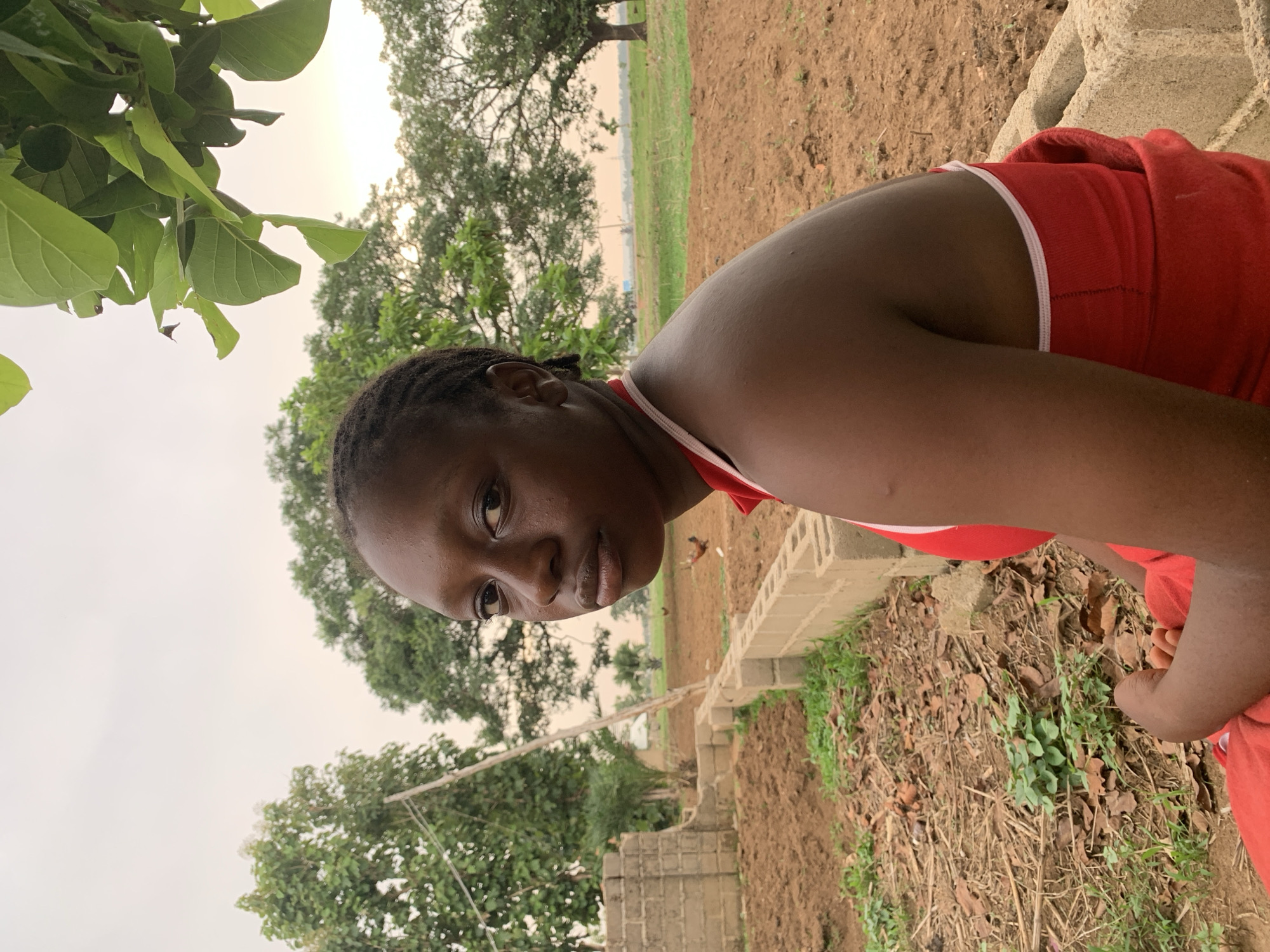 Woman in red tank top spotted across rural Nigeria locations