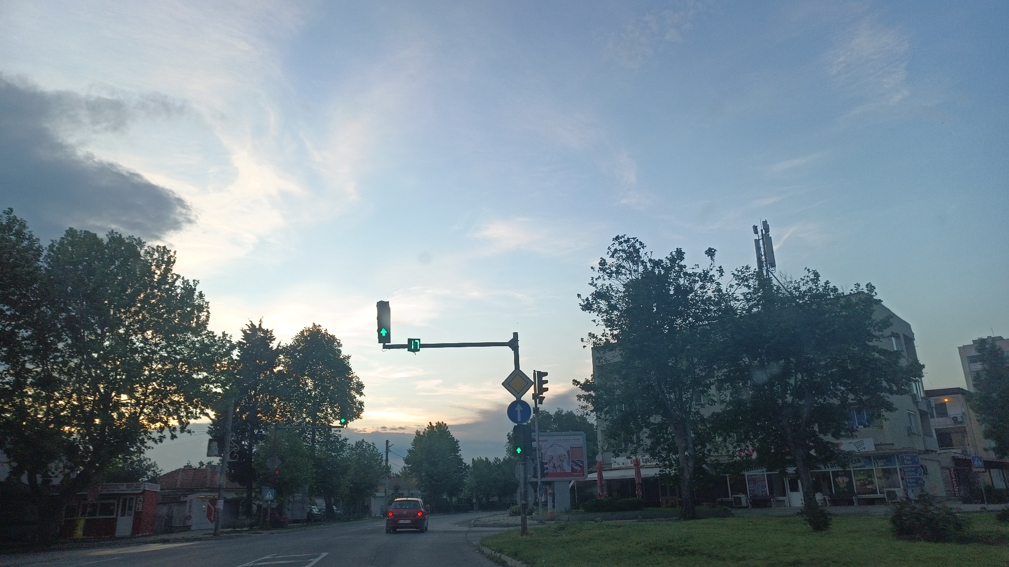 Evening street scenes documented during drive through Aytos, Bulgaria