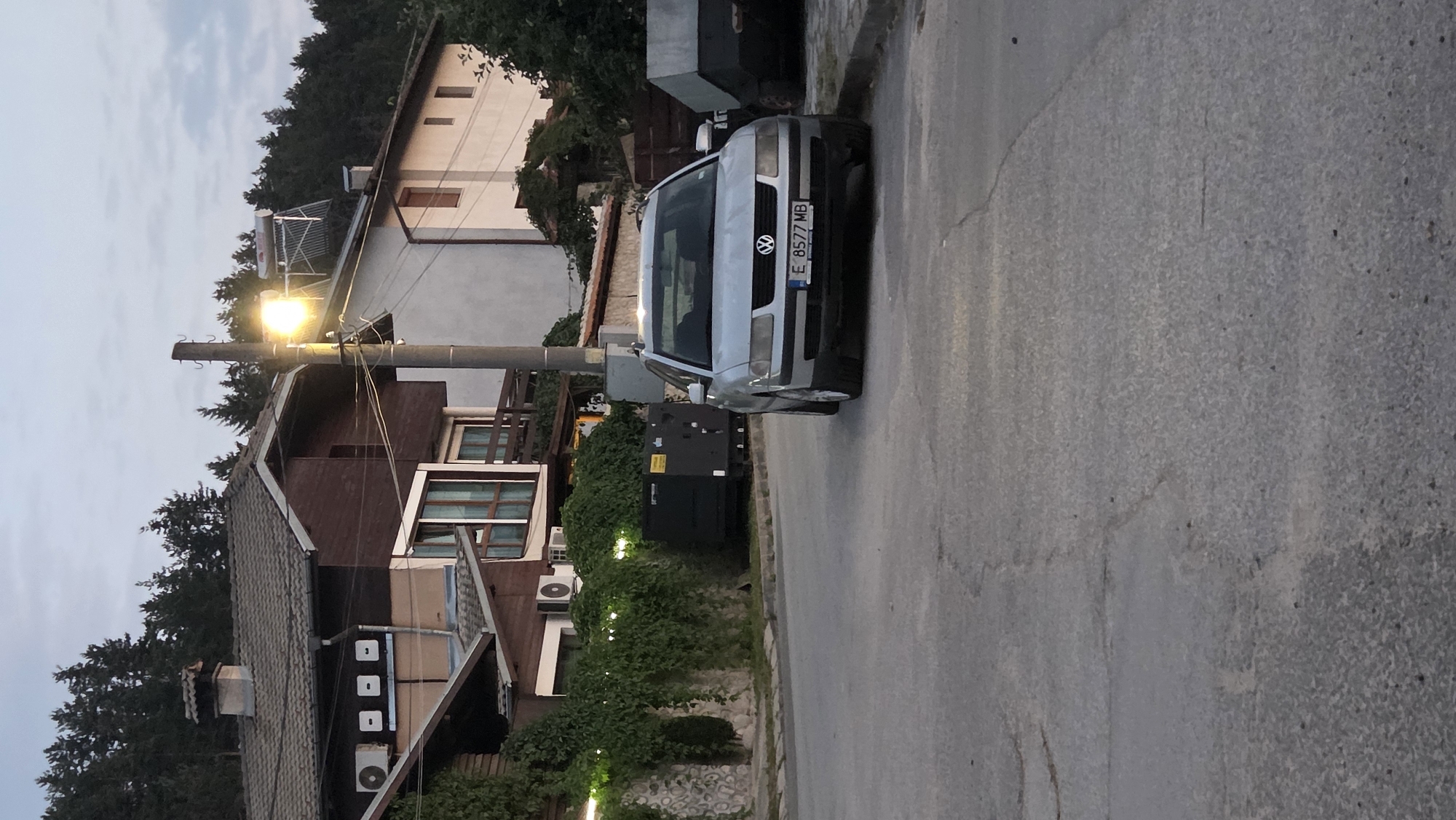 Silver VW Passat parked on quiet suburban street