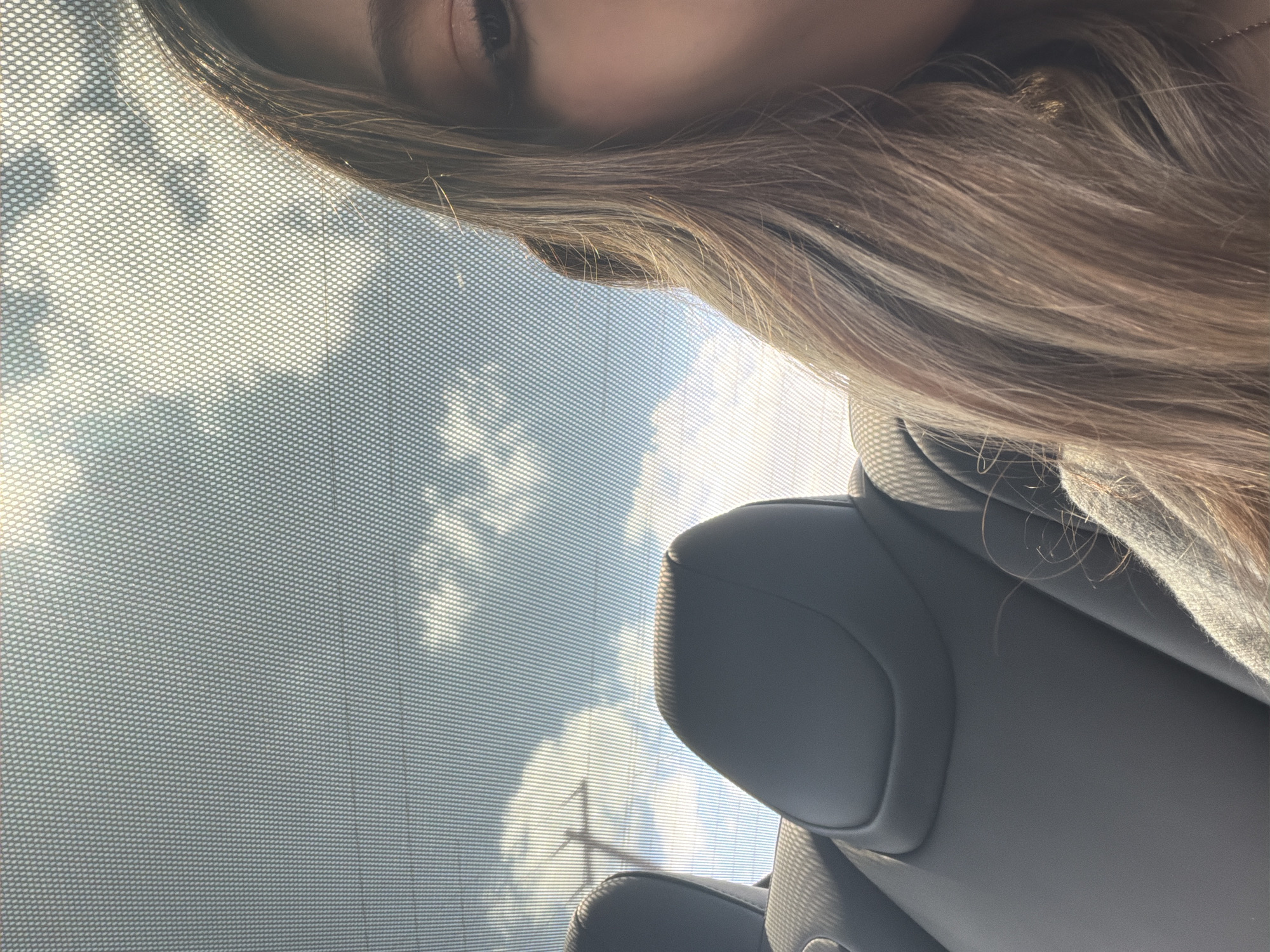Partial portrait captured from vehicle interior in Austin