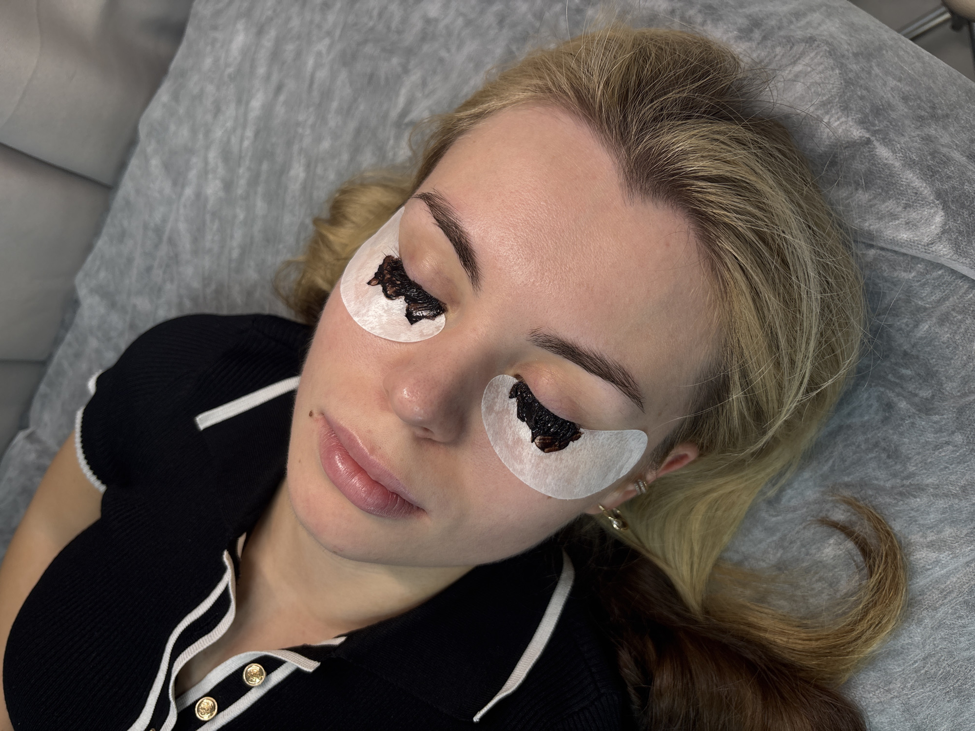 Beauty salon eyelash treatment session documented in Perm