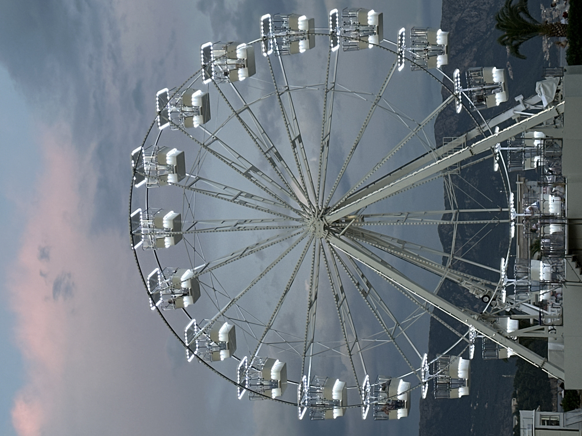 Illuminated Ferris wheel at dusk in Budva, Montenegro
